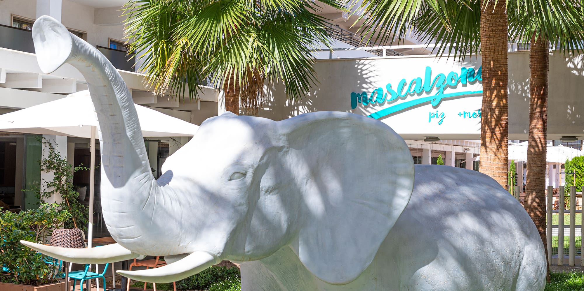 a statue of an elephant in a courtyard