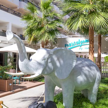 a statue of an elephant in a courtyard