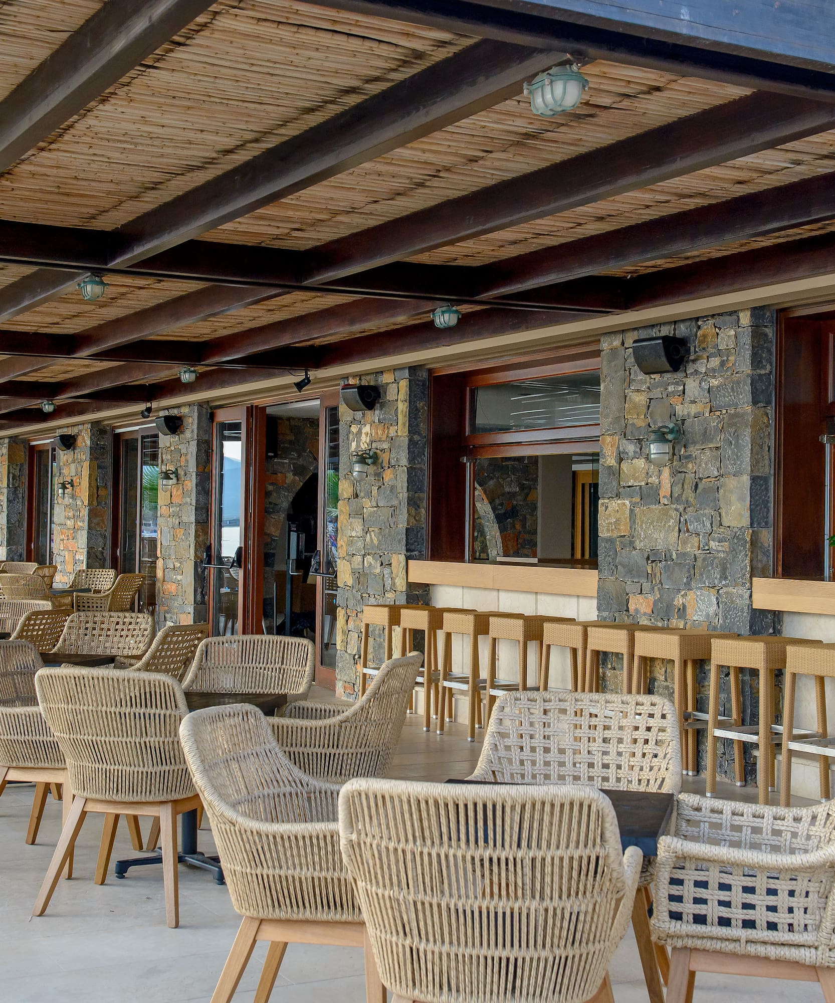 a patio with chairs and tables