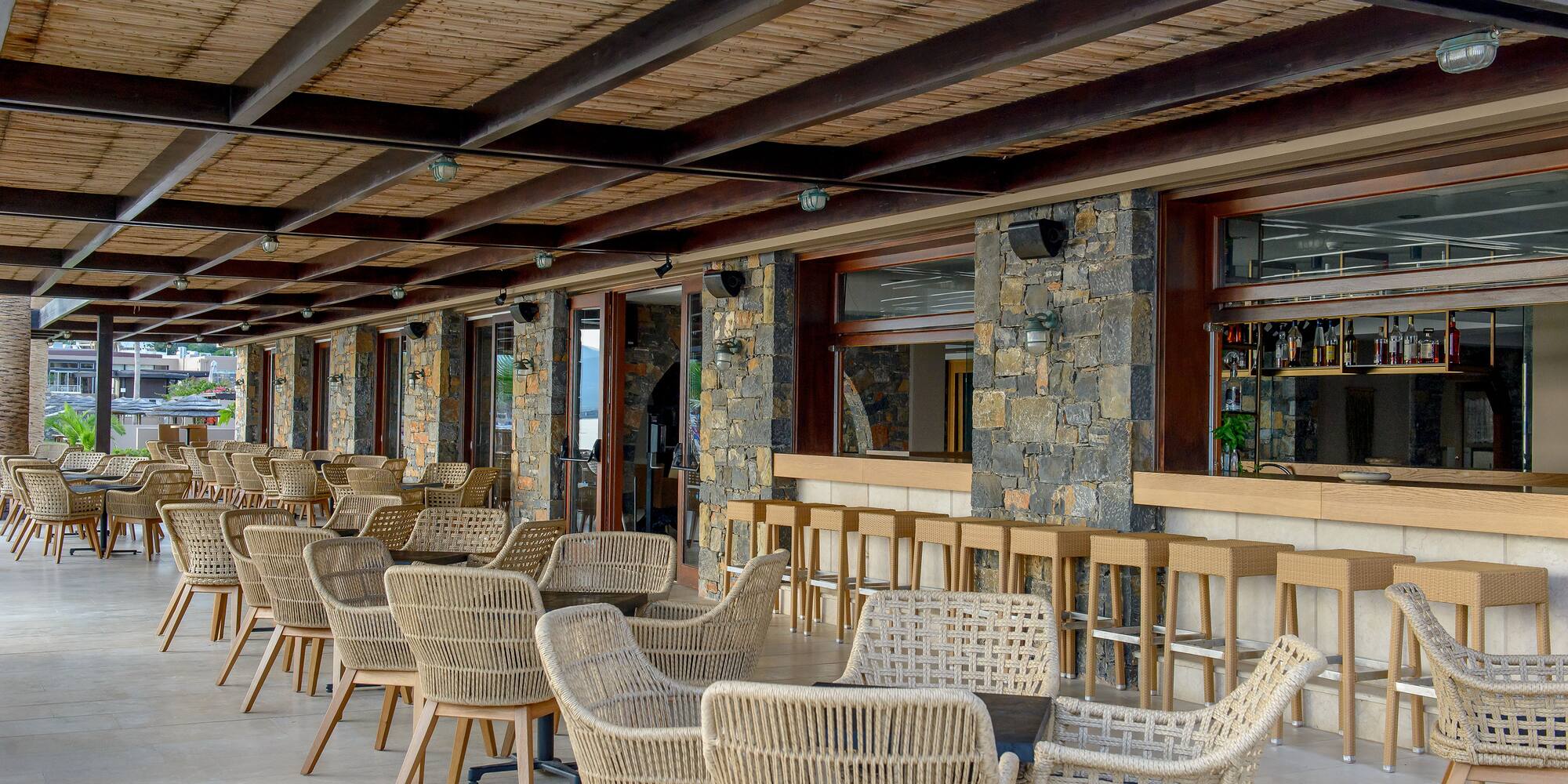 a patio with chairs and tables