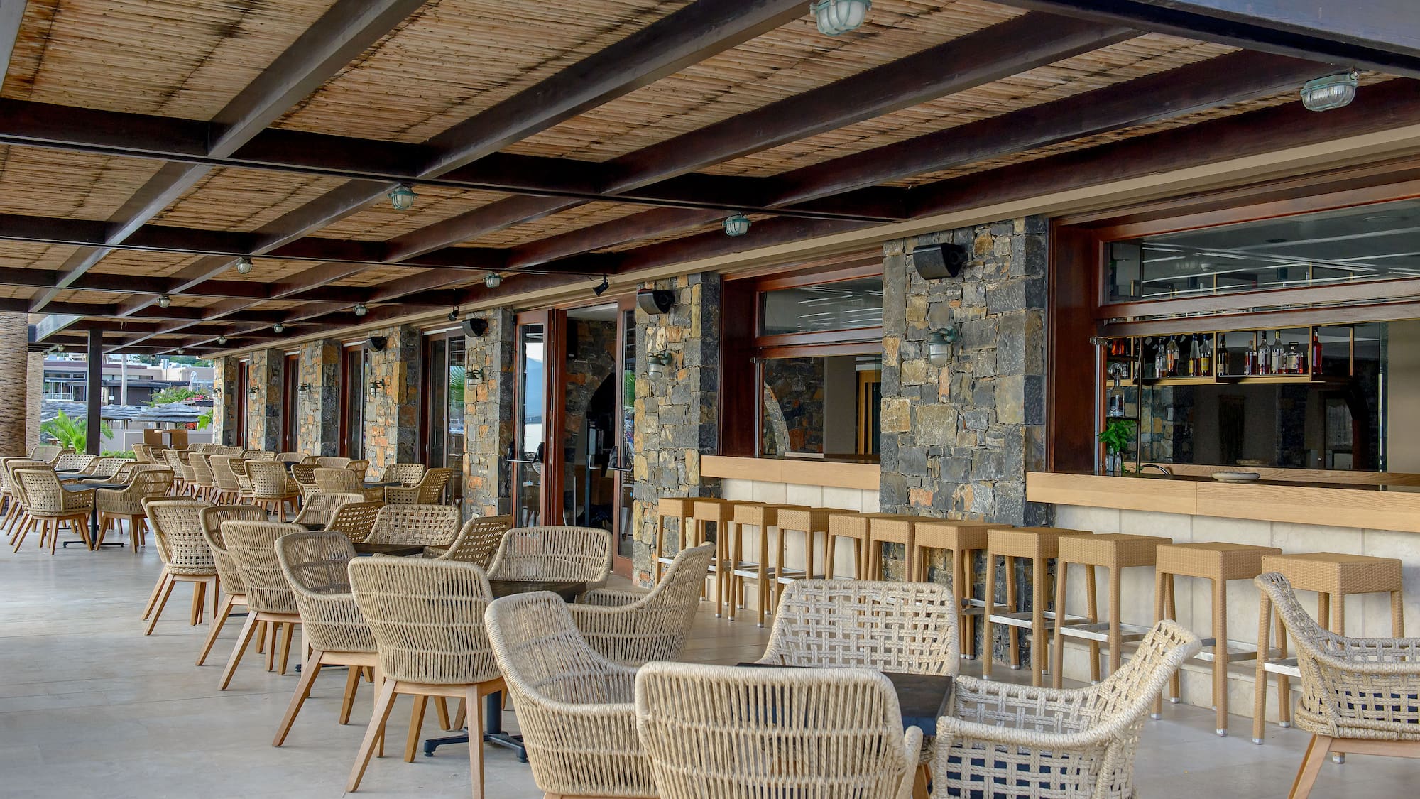 a patio with chairs and tables