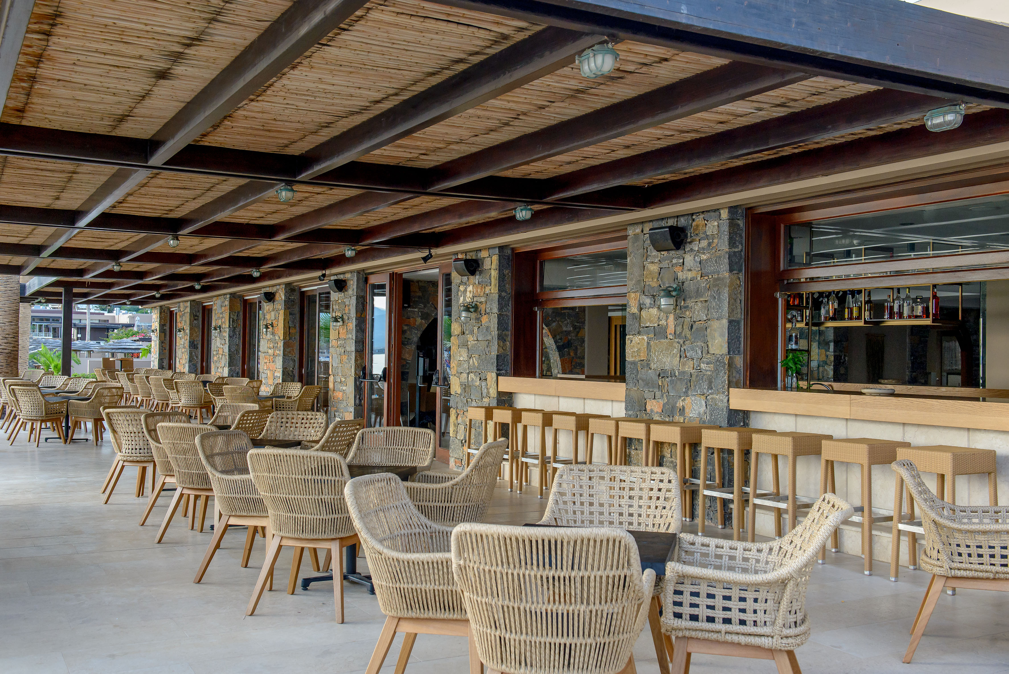 a patio with chairs and tables