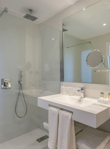 a bathroom with a shower and sink
