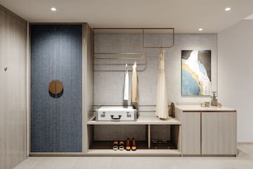 a room with a white suitcase and shoes on a shelf