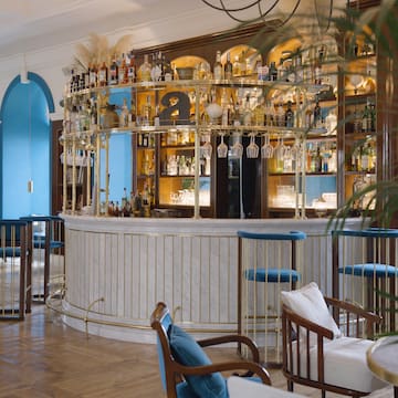 a bar with bottles on shelves