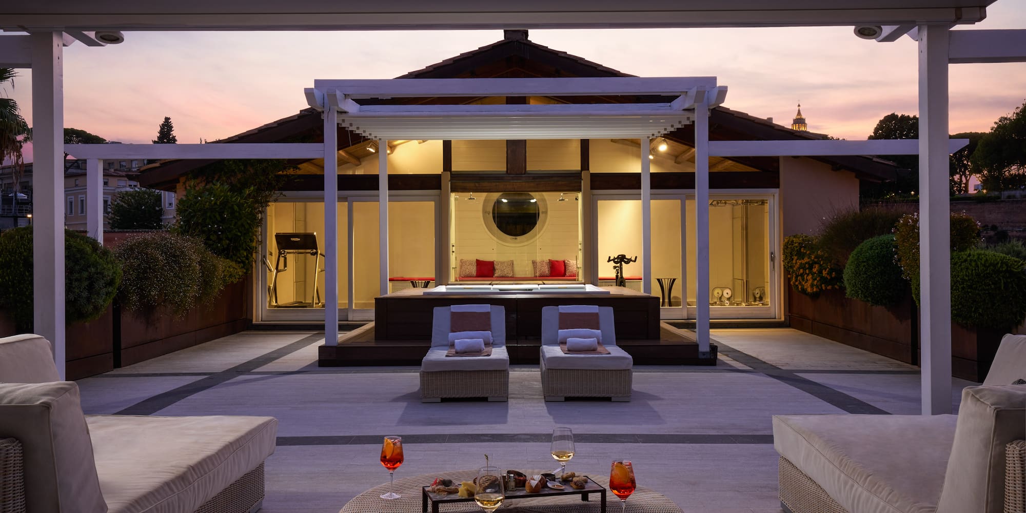 a patio with a large deck and a large pool