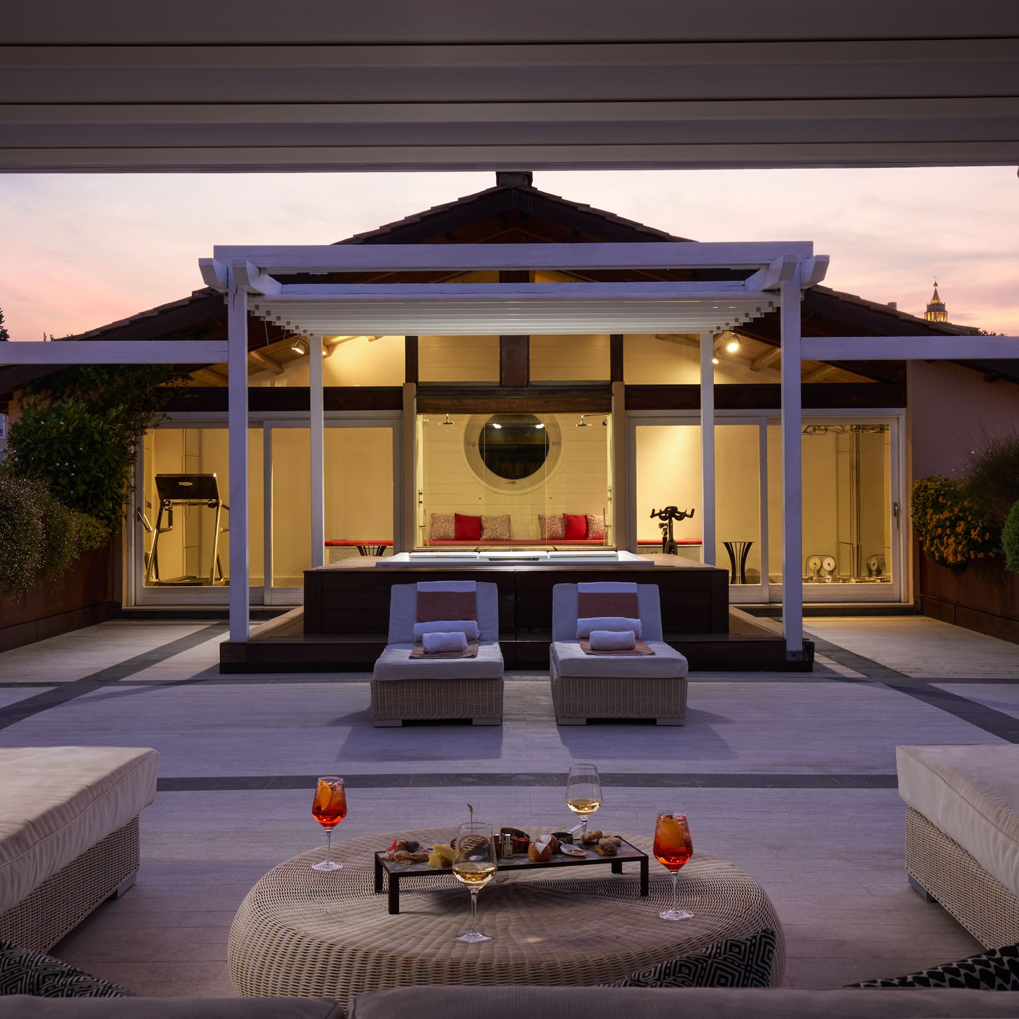 a patio with a large deck and a large pool