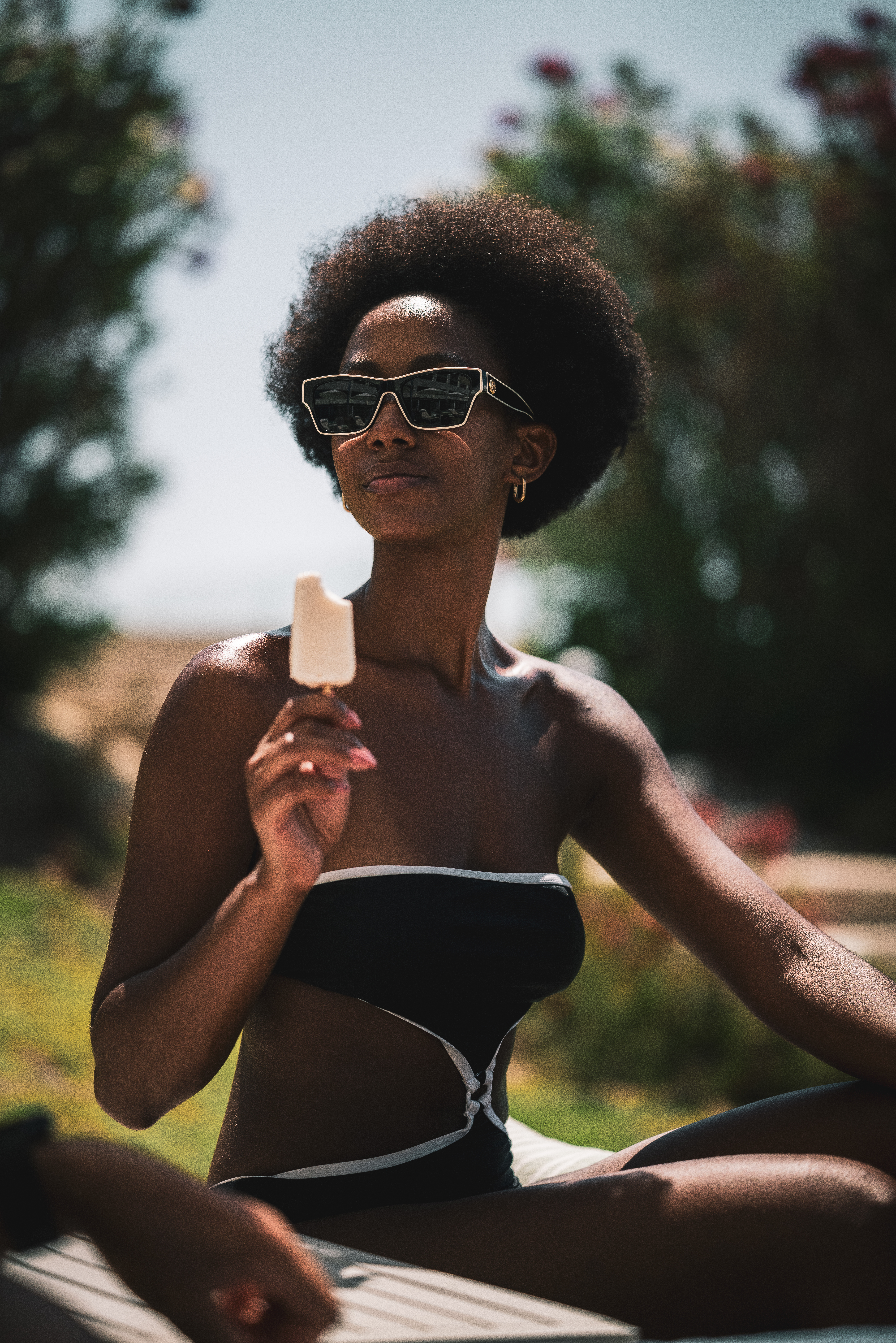 a woman in a garment holding an ice cream