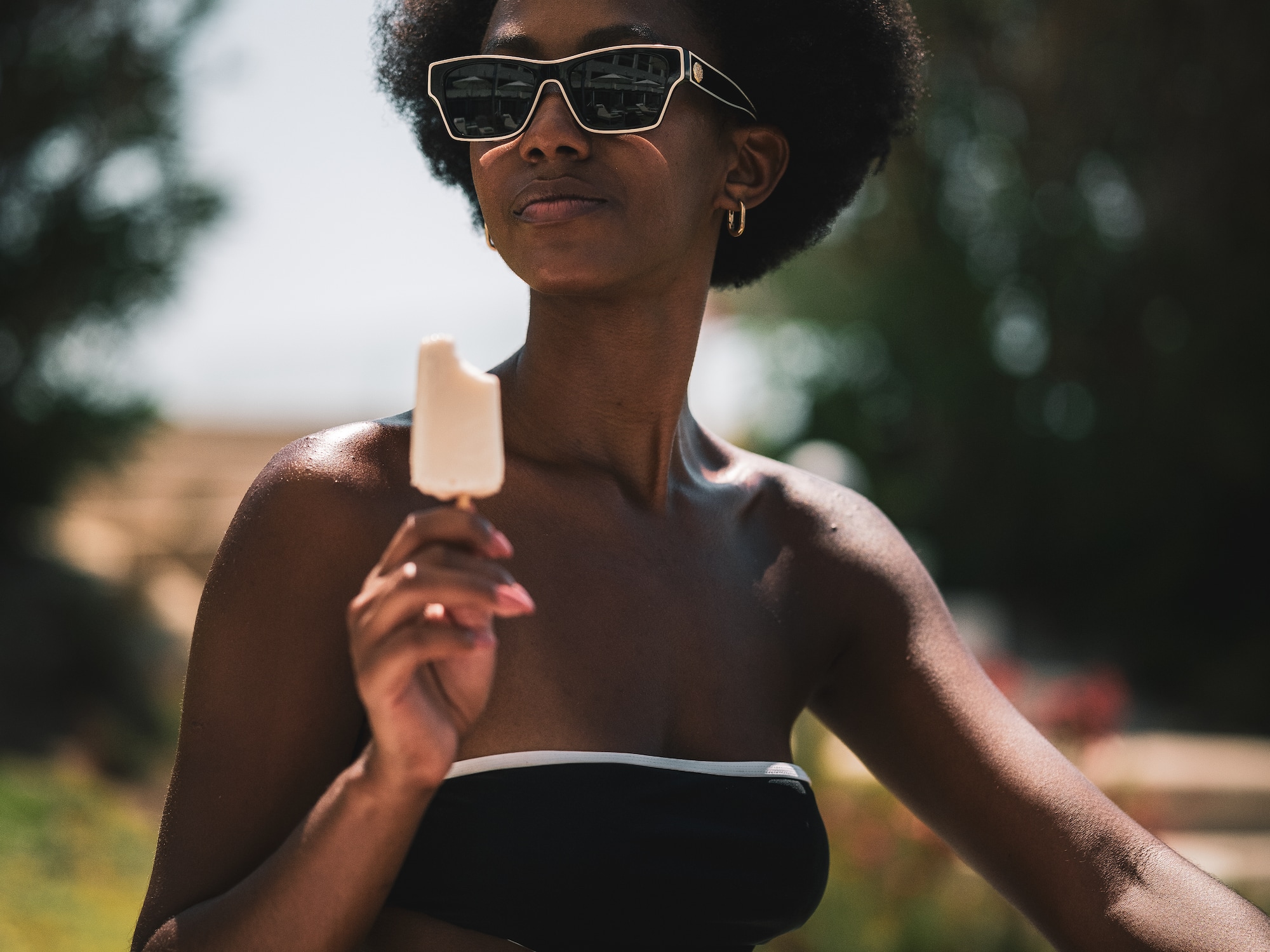 a woman in a garment holding an ice cream