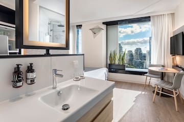 a bathroom with a mirror and sink