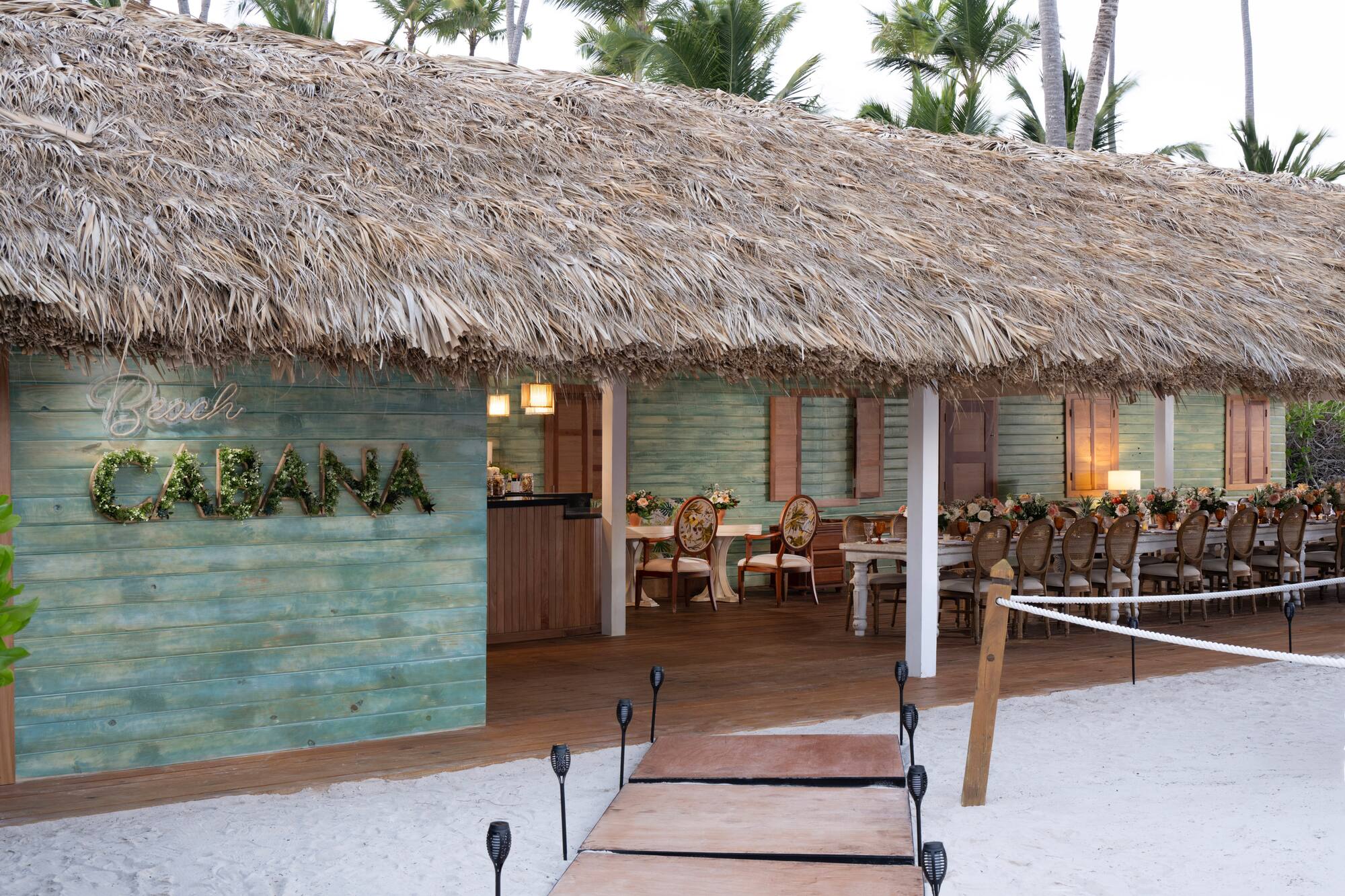 a hut with a thatched roof