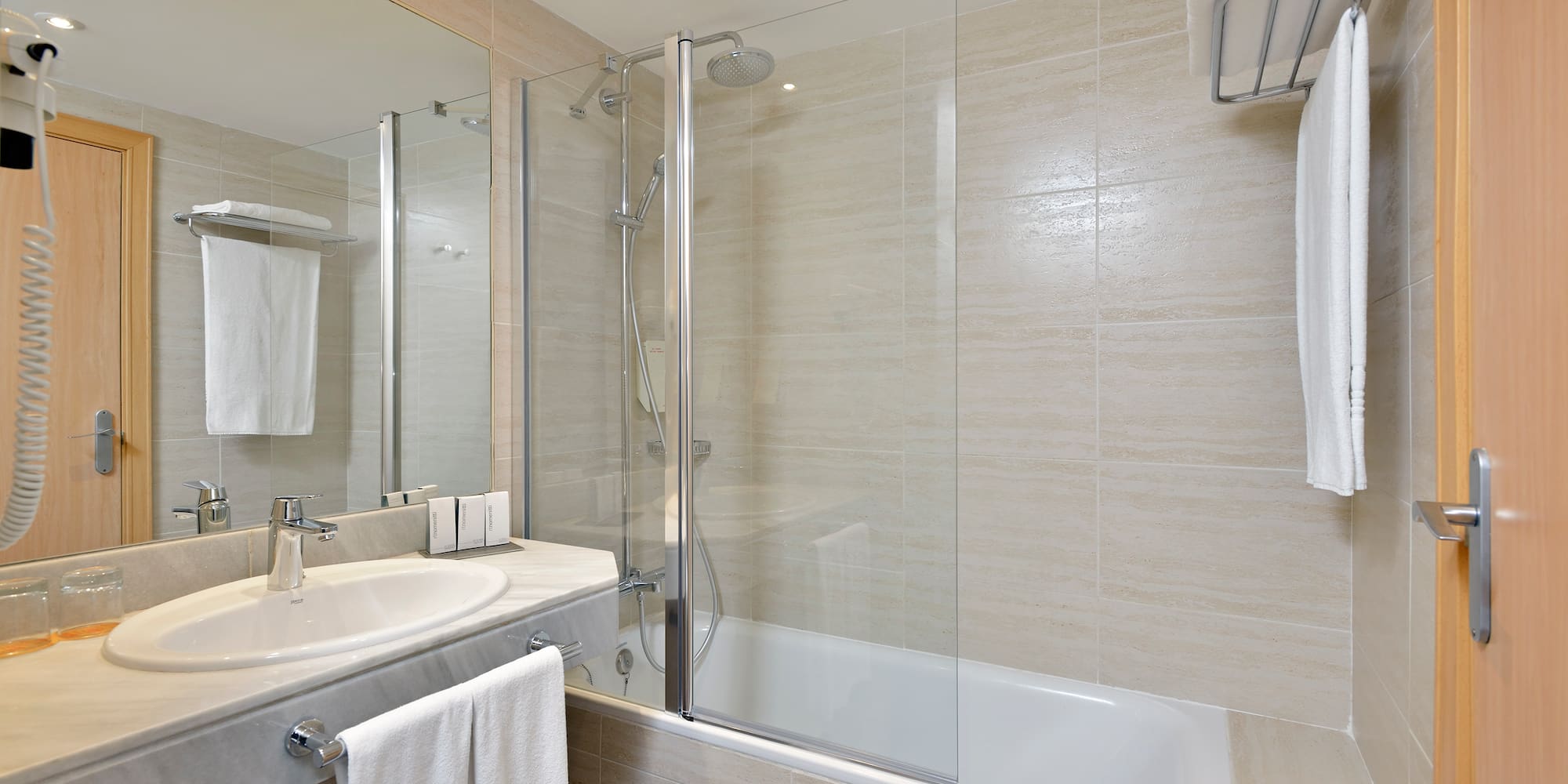a bathroom with a shower and tub
