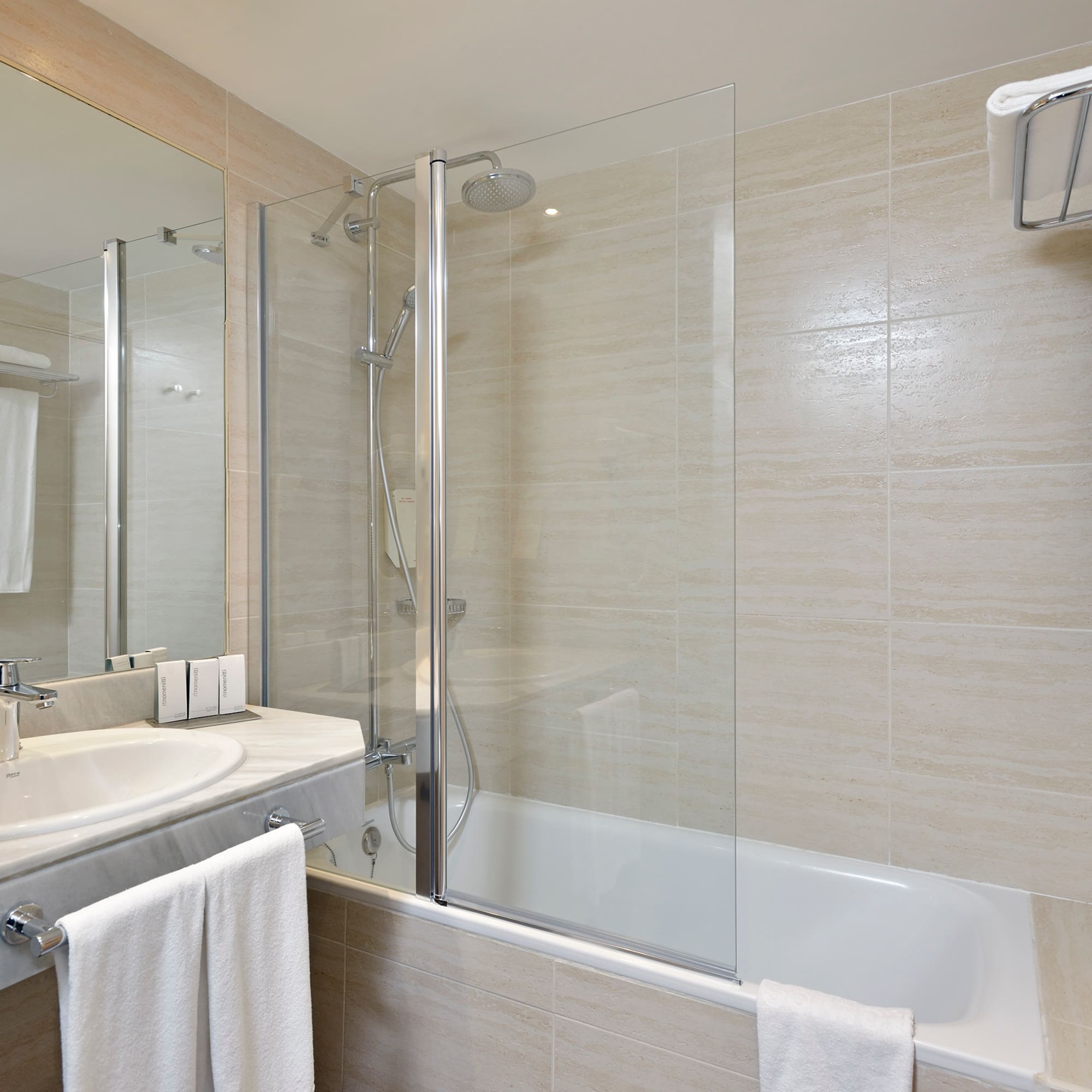 a bathroom with a shower and tub