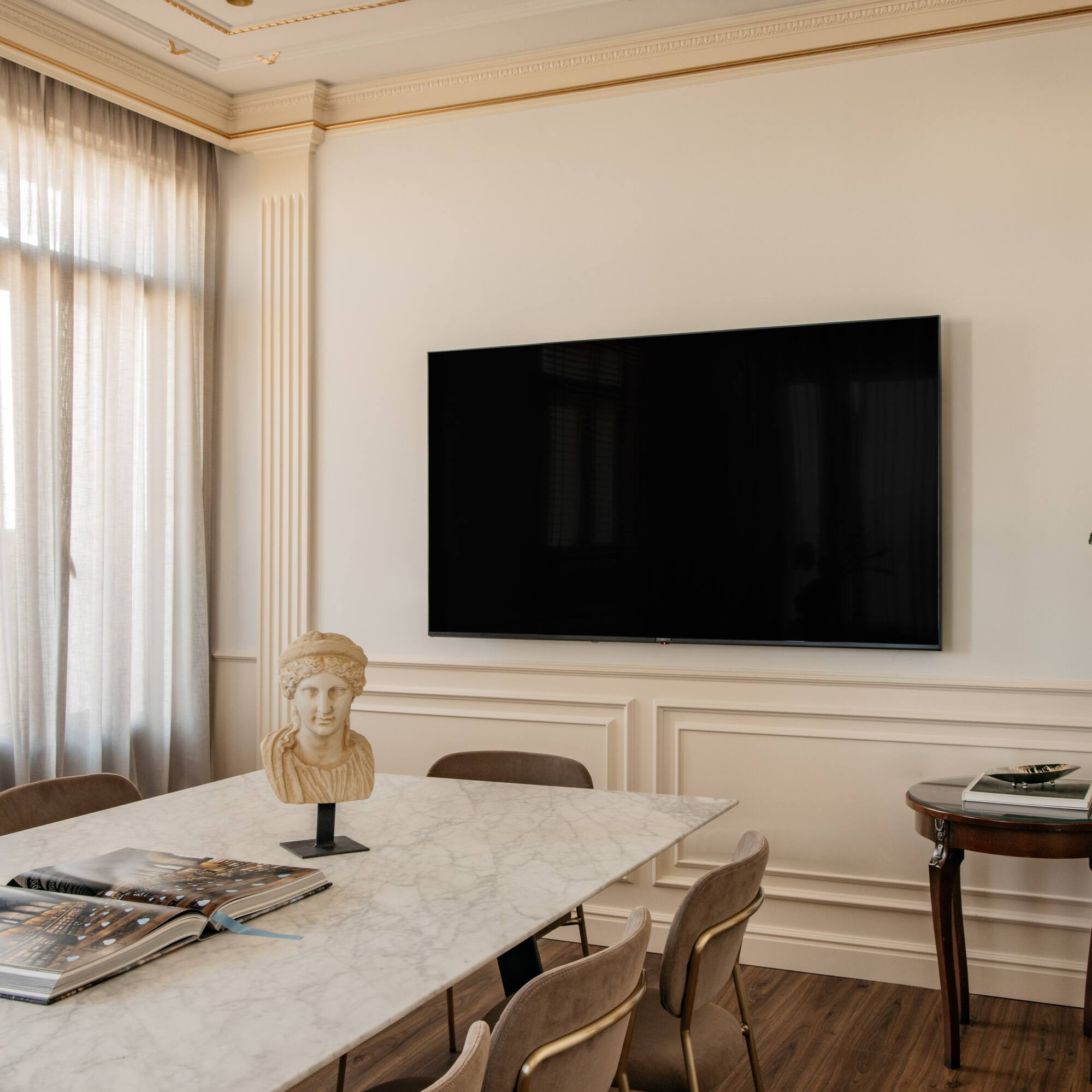 a room with a table and a tv