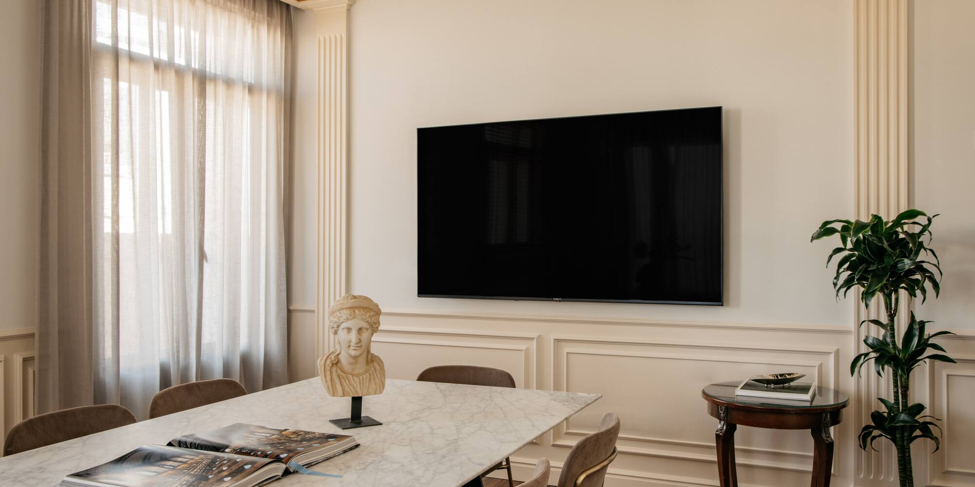 a room with a table and a tv