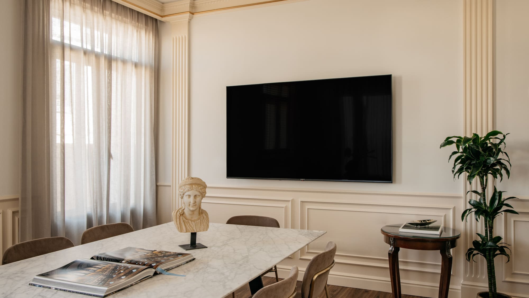 a room with a table and a tv