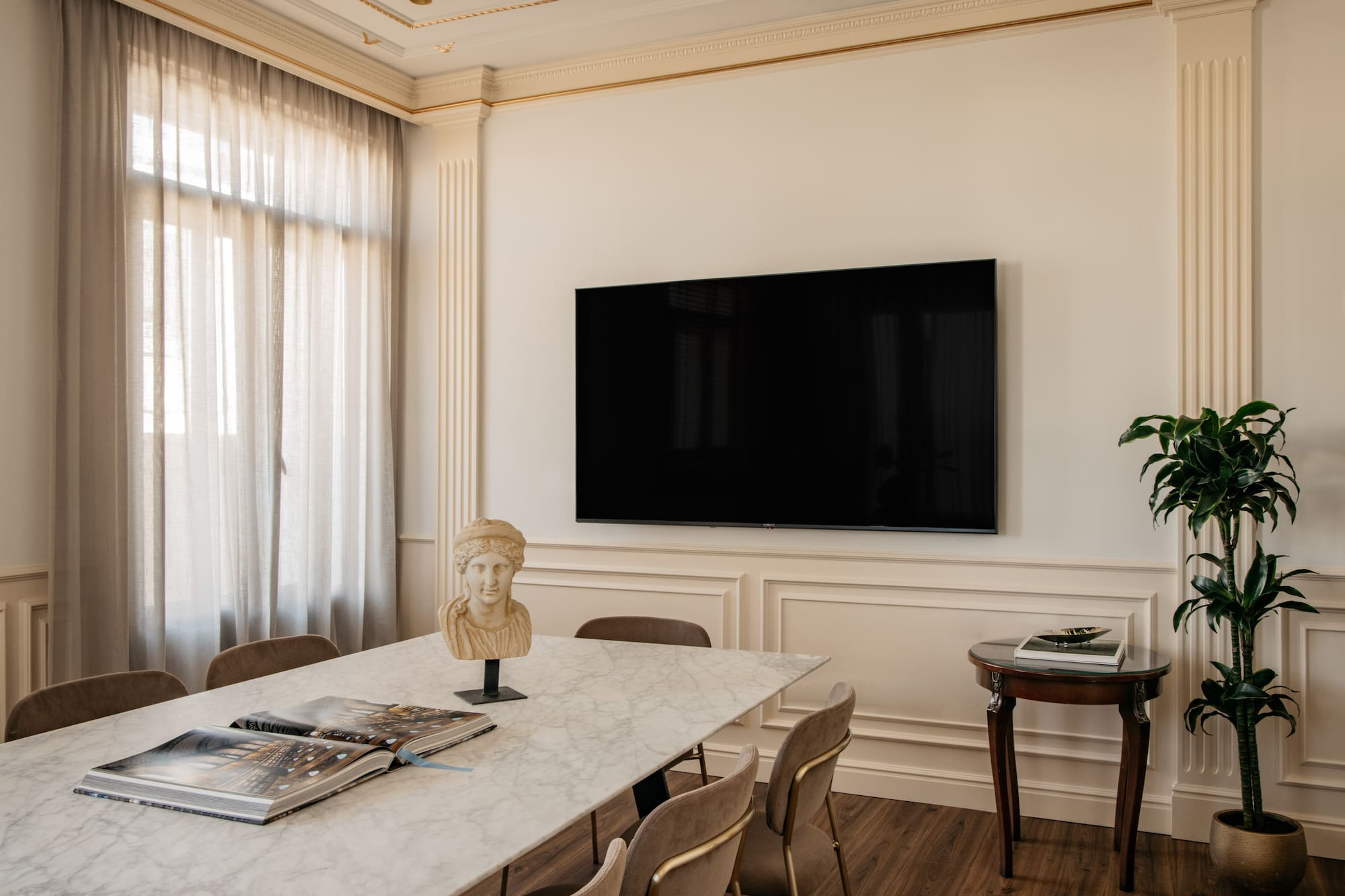 a room with a table and a tv