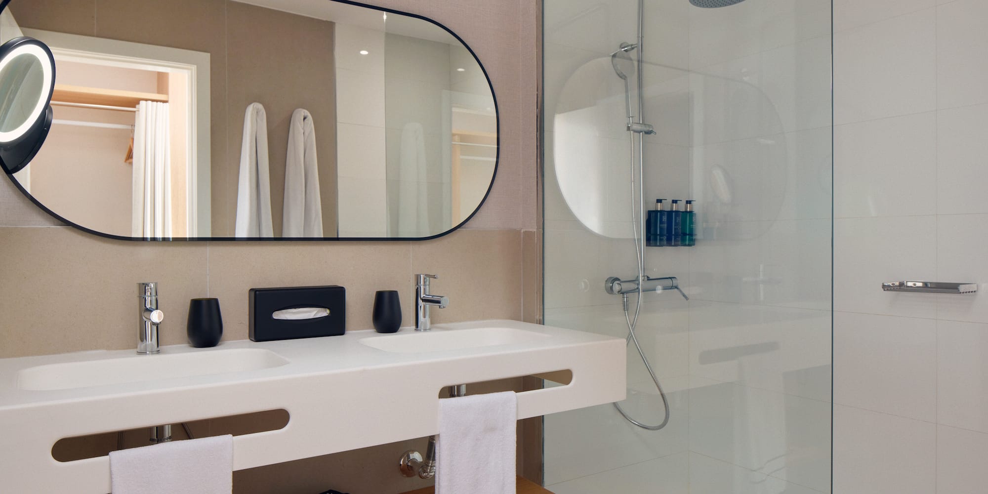 a bathroom with a mirror and shower