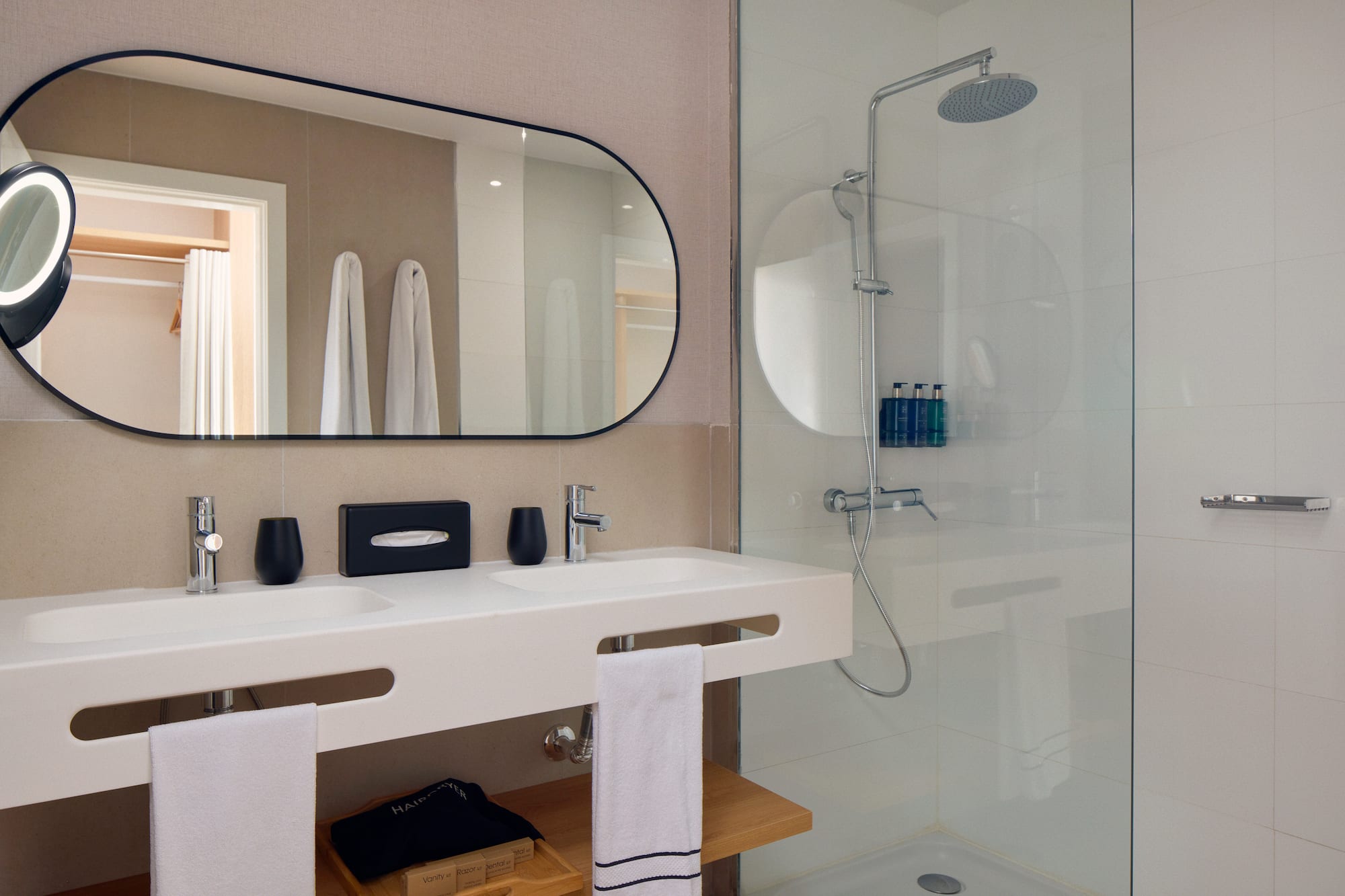 a bathroom with a mirror and shower