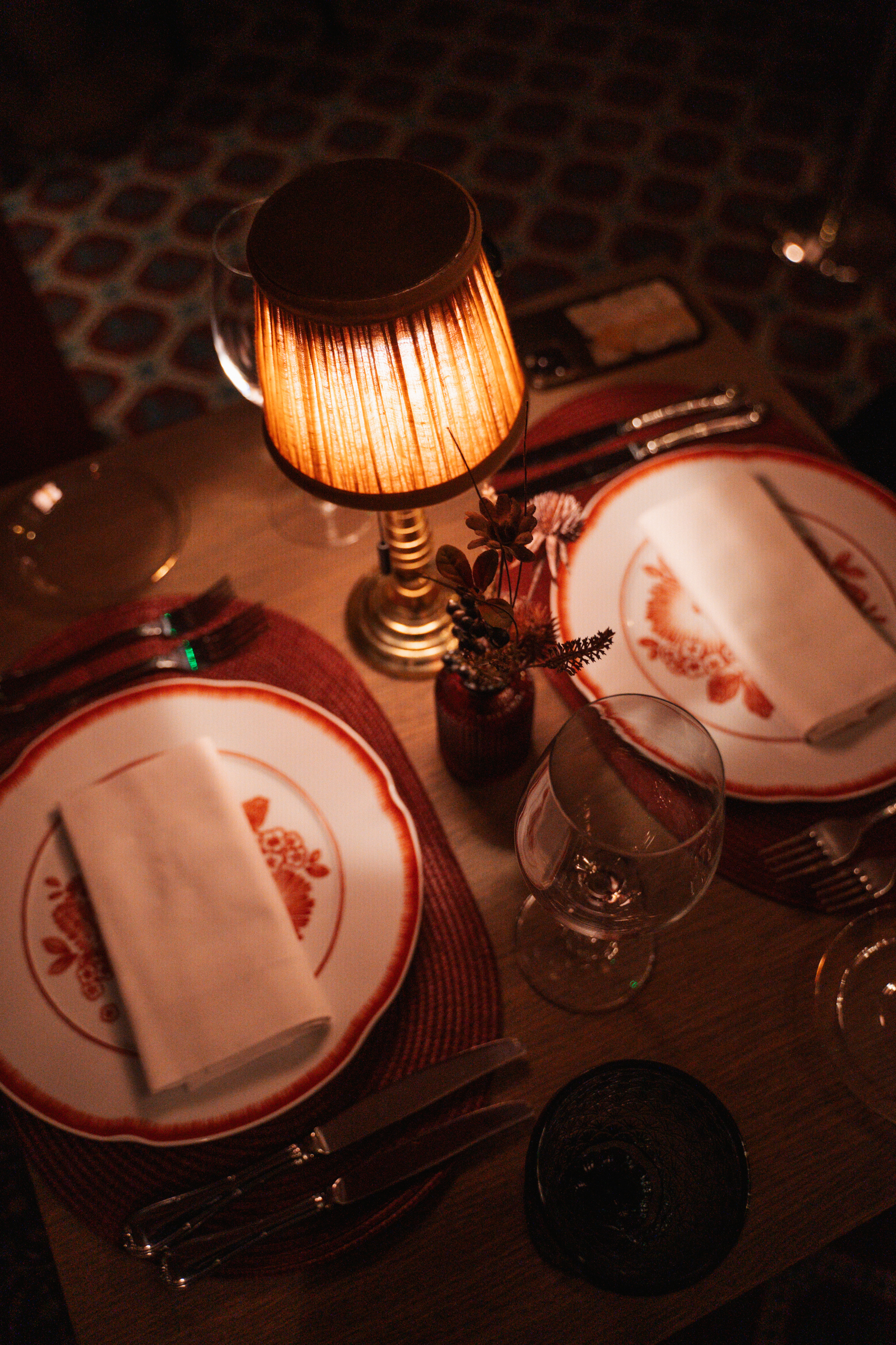 a table with plates and glasses