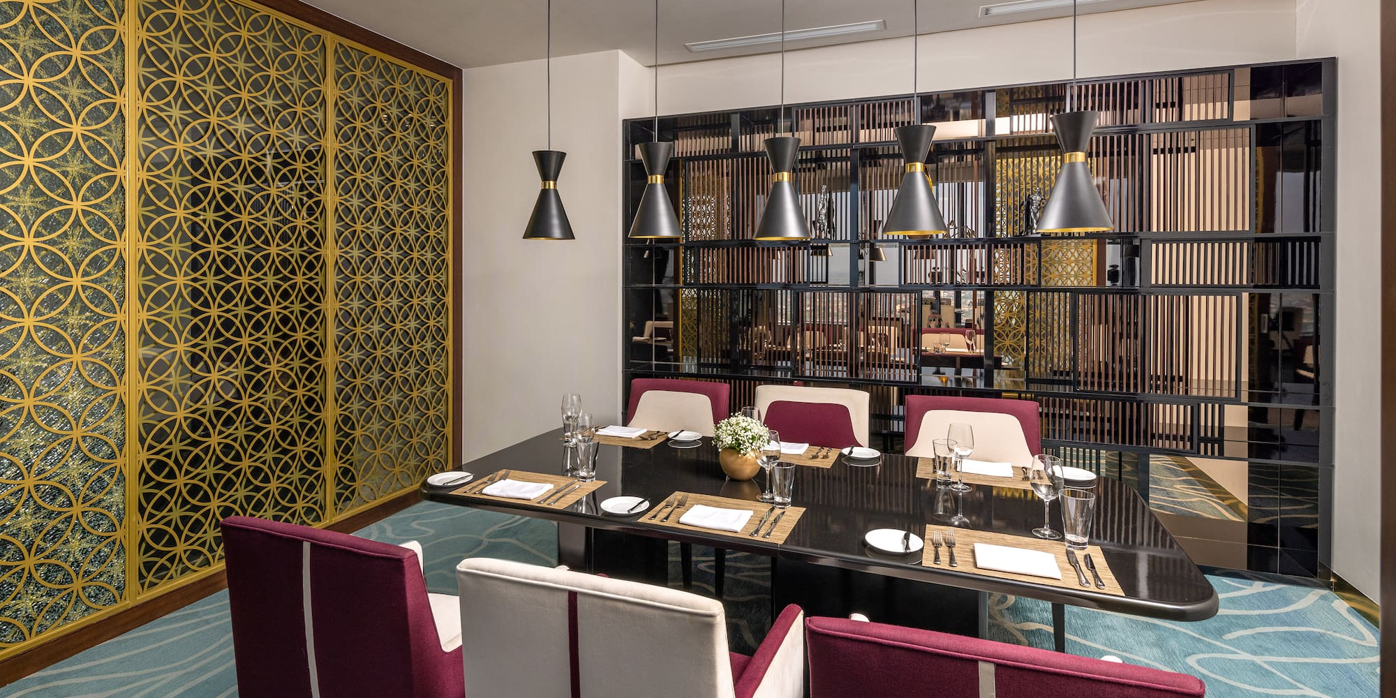 a dining room with a table and chairs