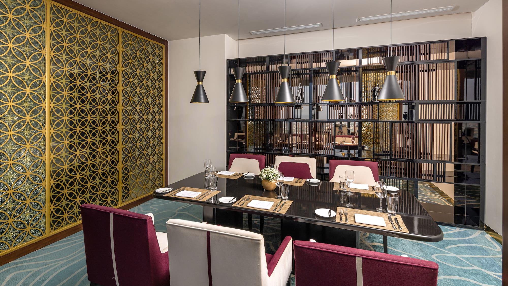 a dining room with a table and chairs