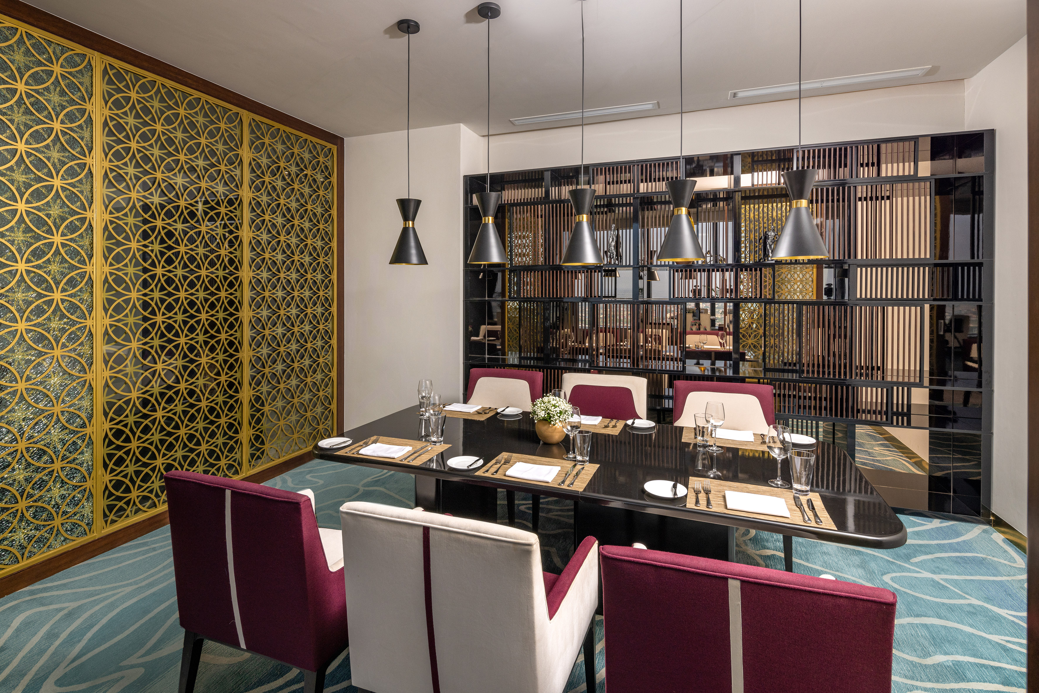 a dining room with a table and chairs