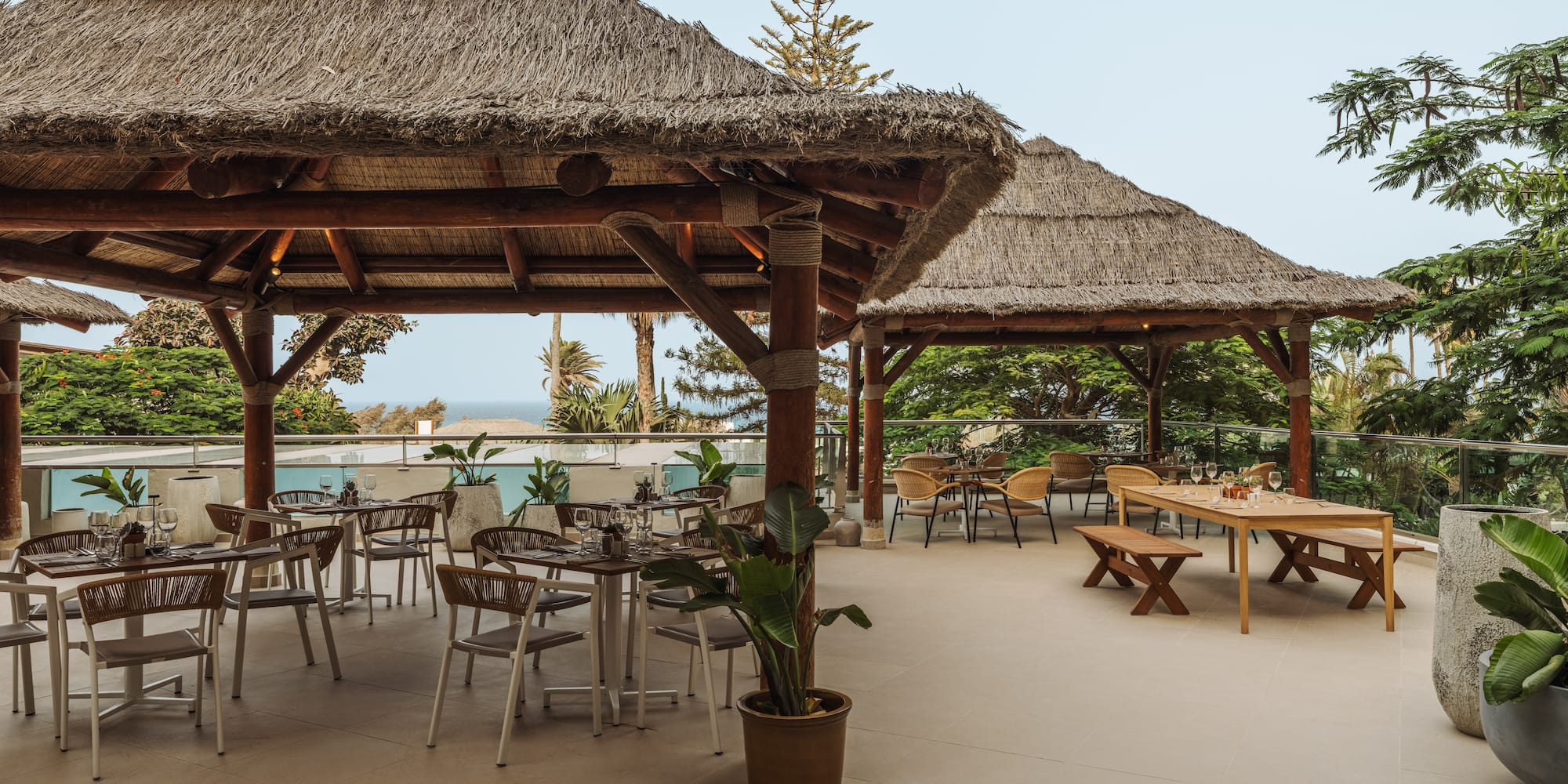 a patio with tables and chairs
