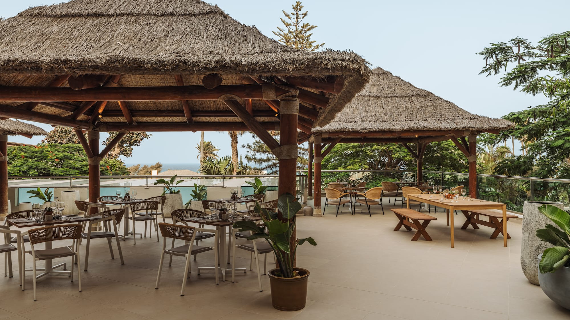 a patio with tables and chairs