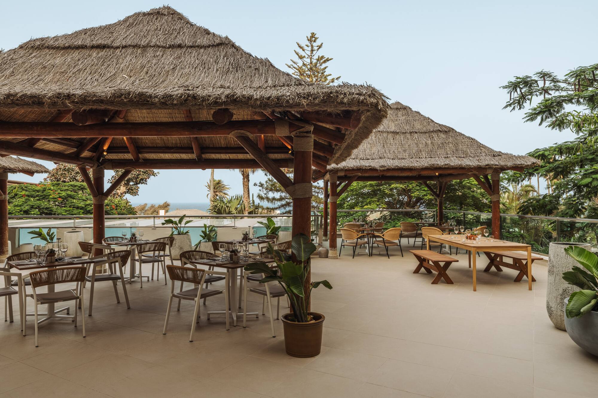 a patio with tables and chairs