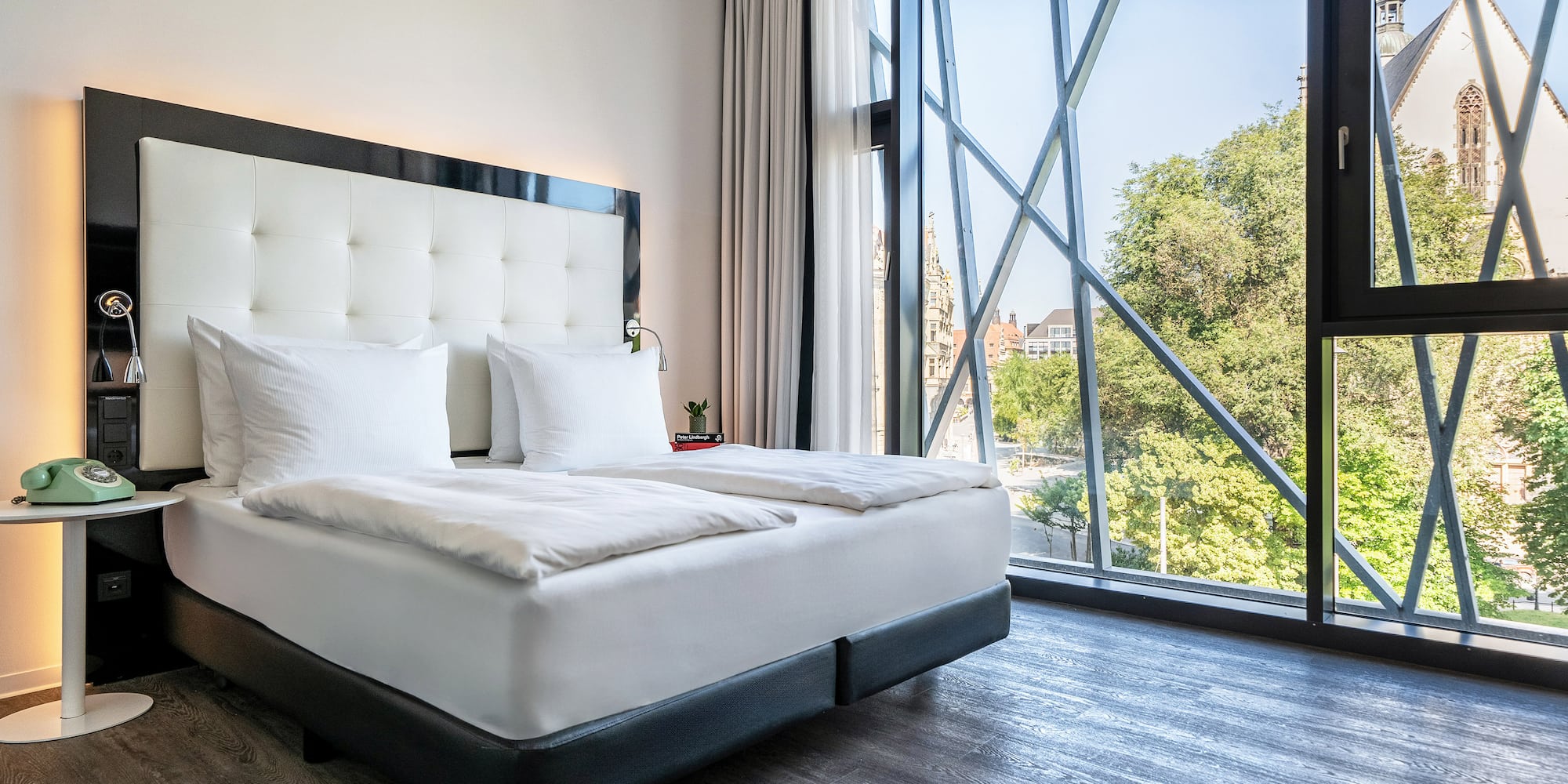 a bed with a large window