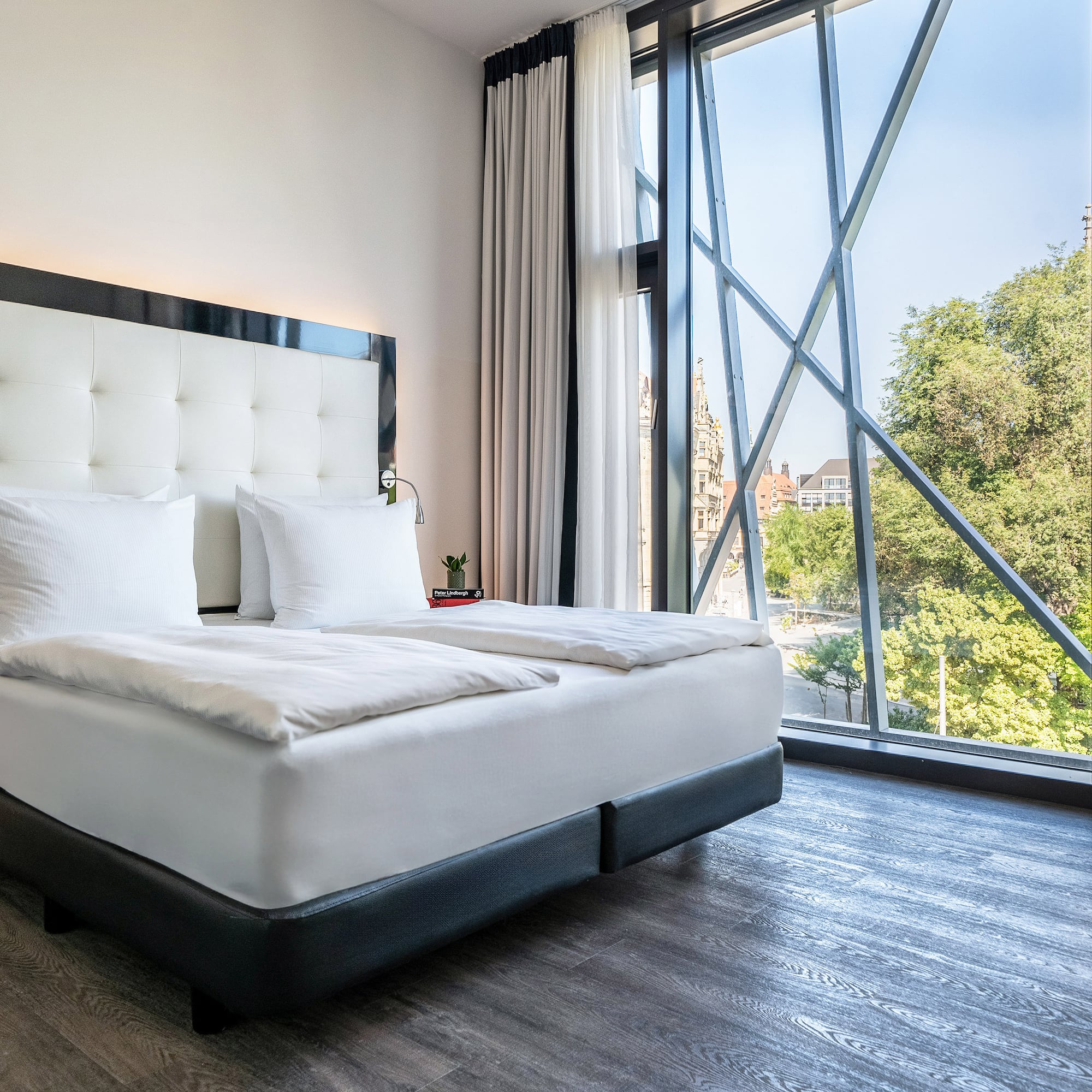 a bed with a large window