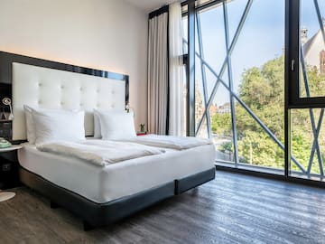 a bed with a large window