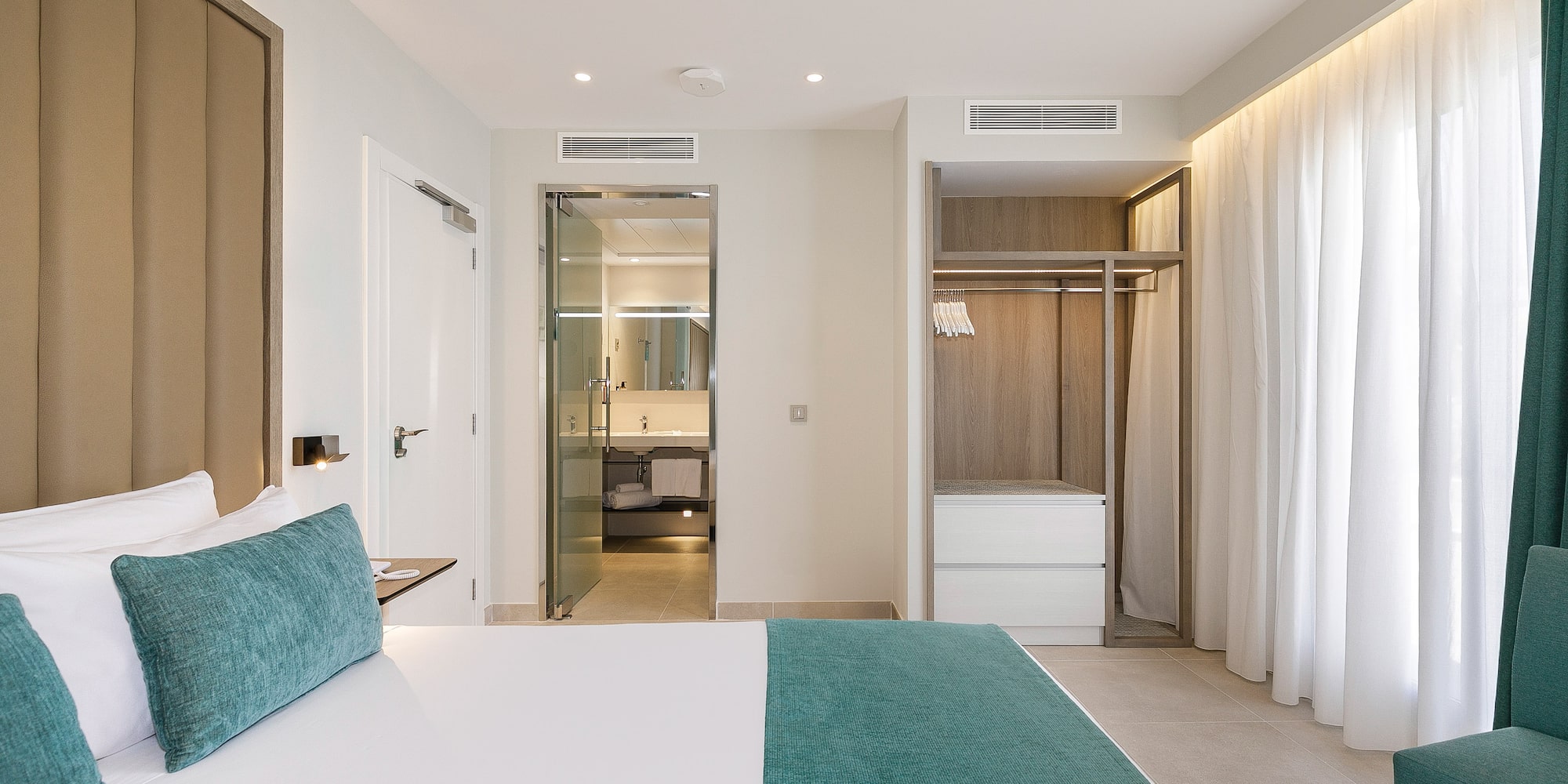 a room with a bed and shower