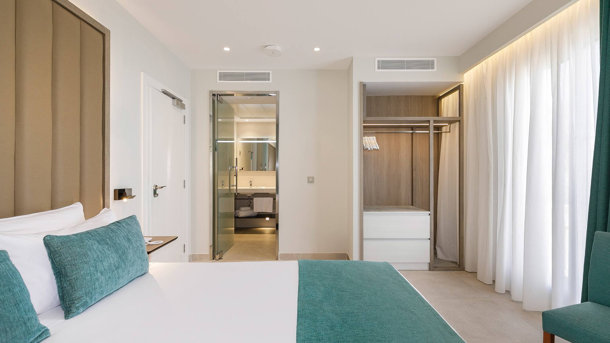 a room with a bed and shower