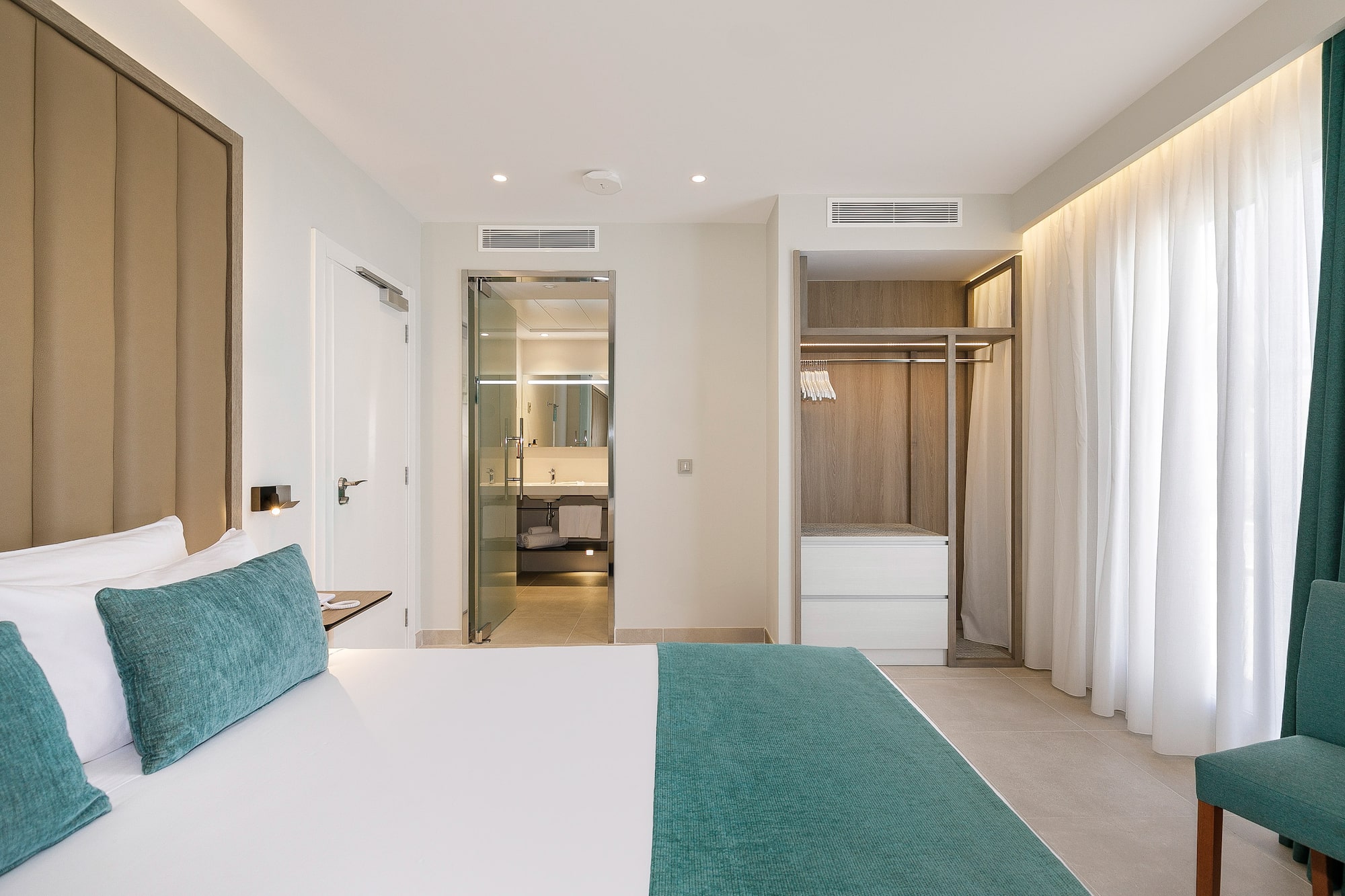 a room with a bed and shower