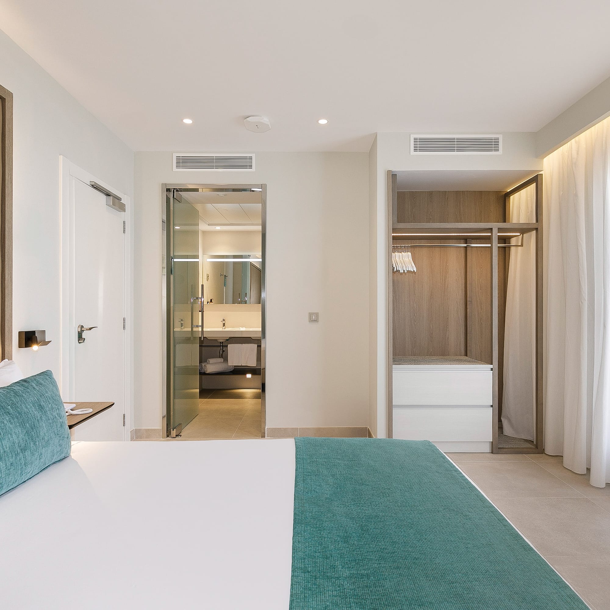 a room with a bed and shower