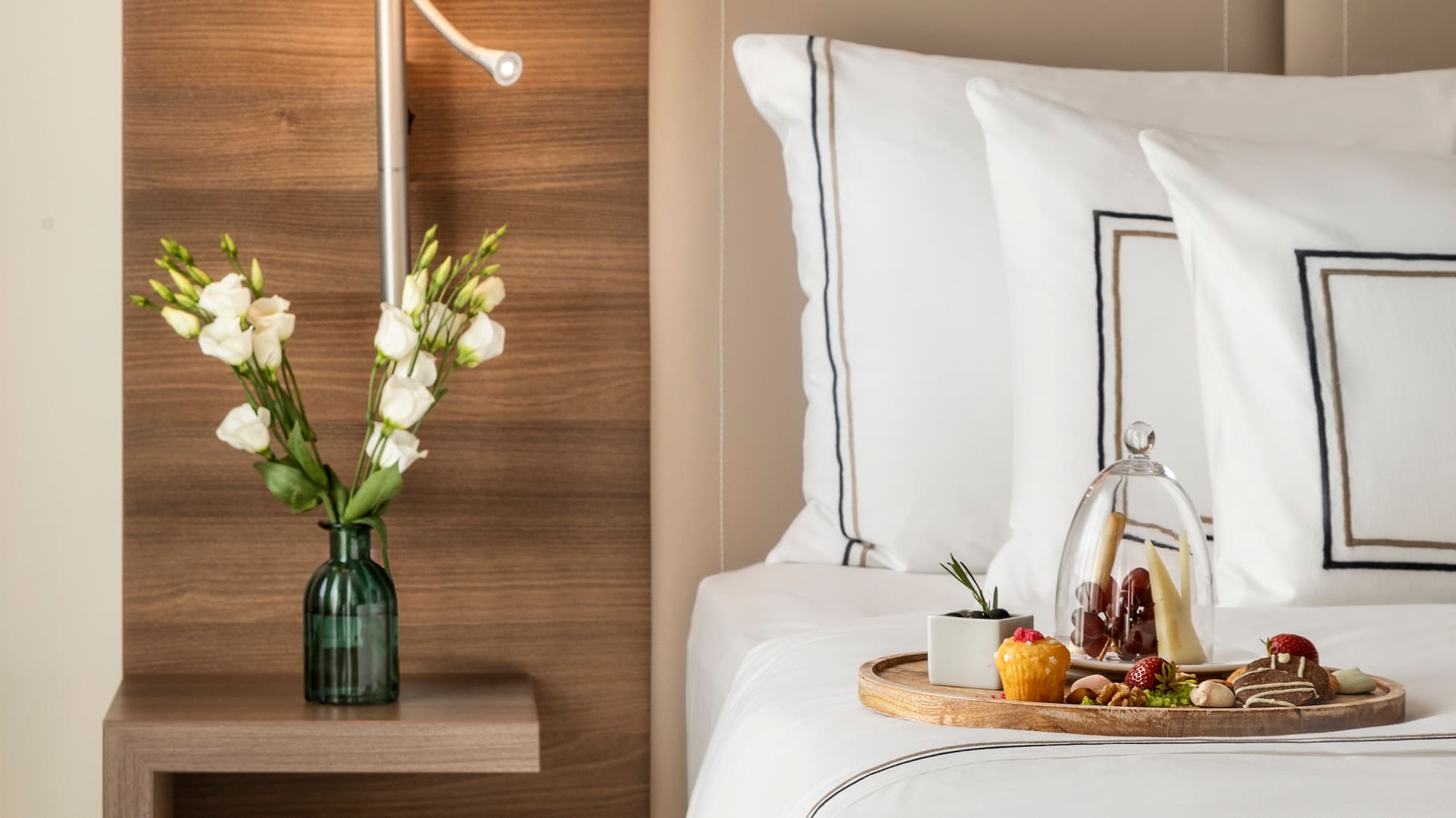 a tray of food on a bed