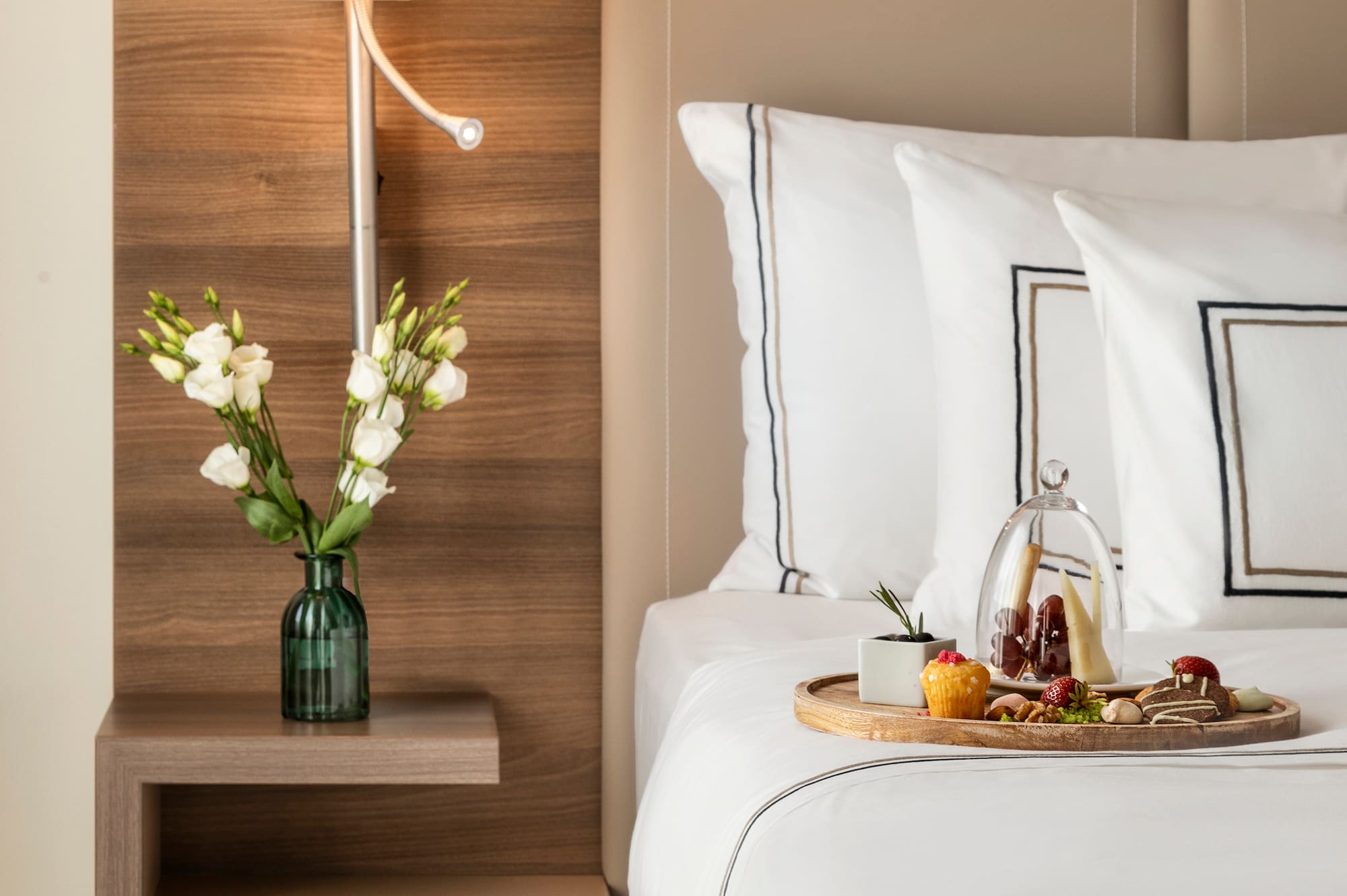 a tray of food on a bed