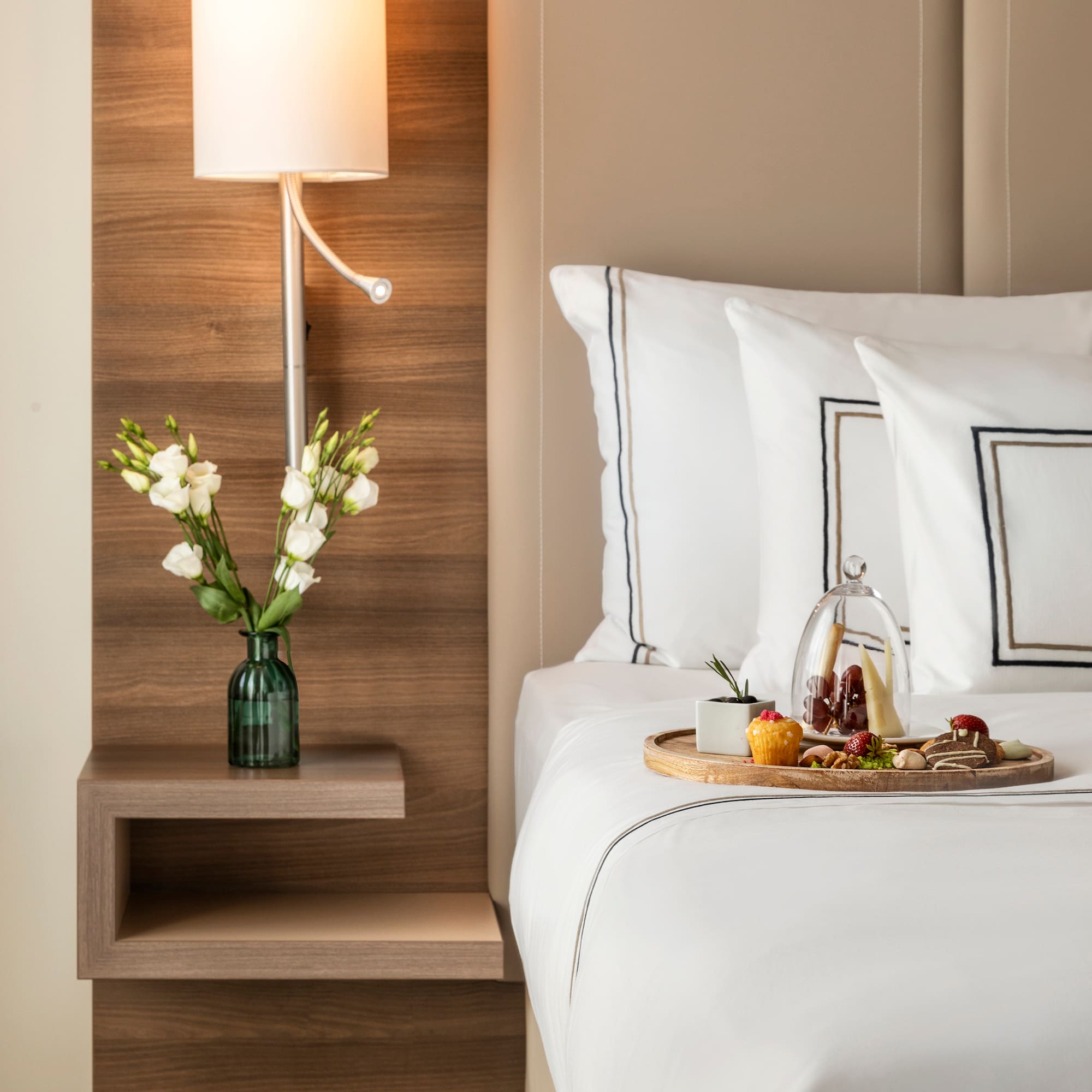 a tray of food on a bed