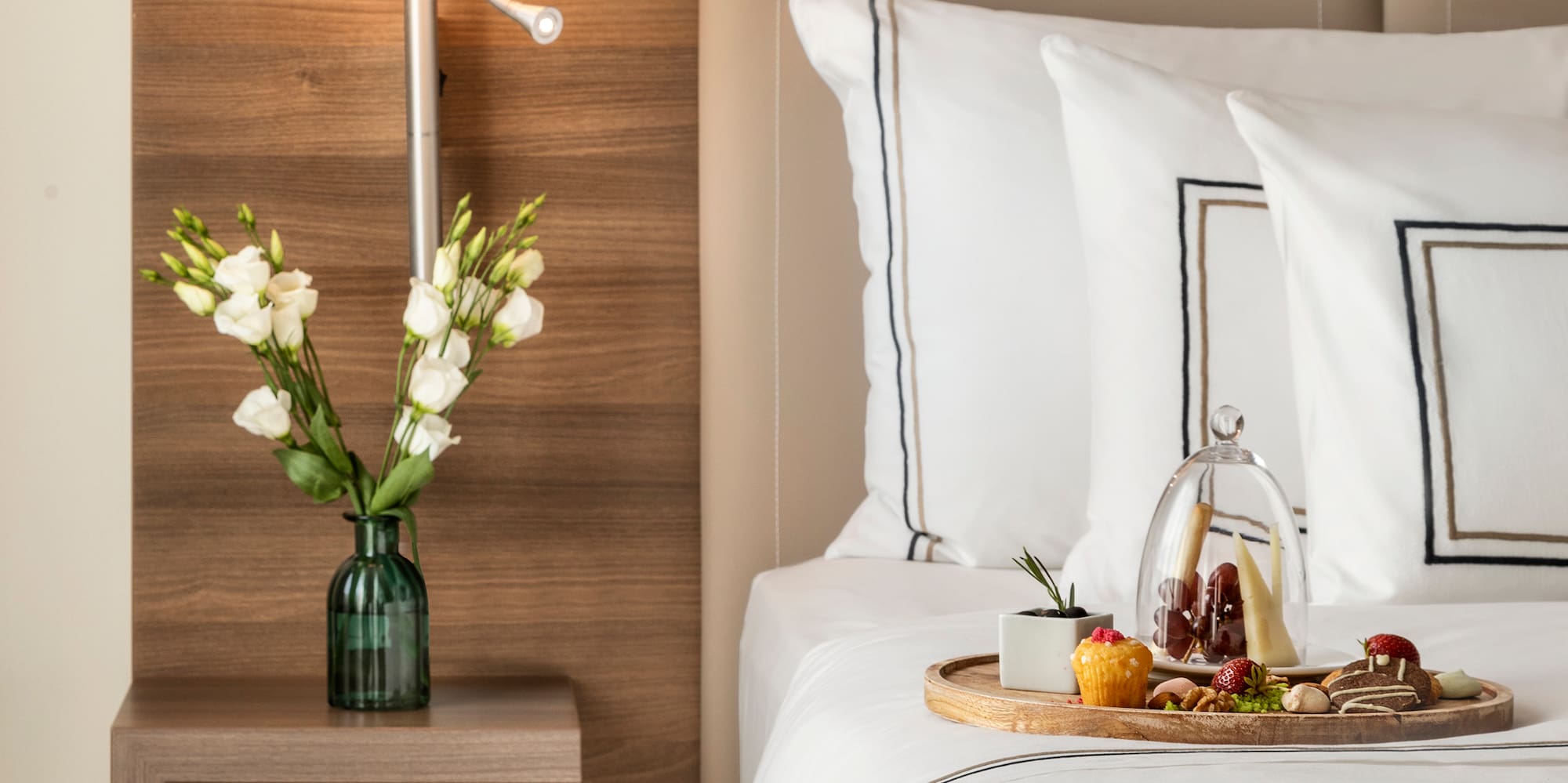 a tray of food on a bed