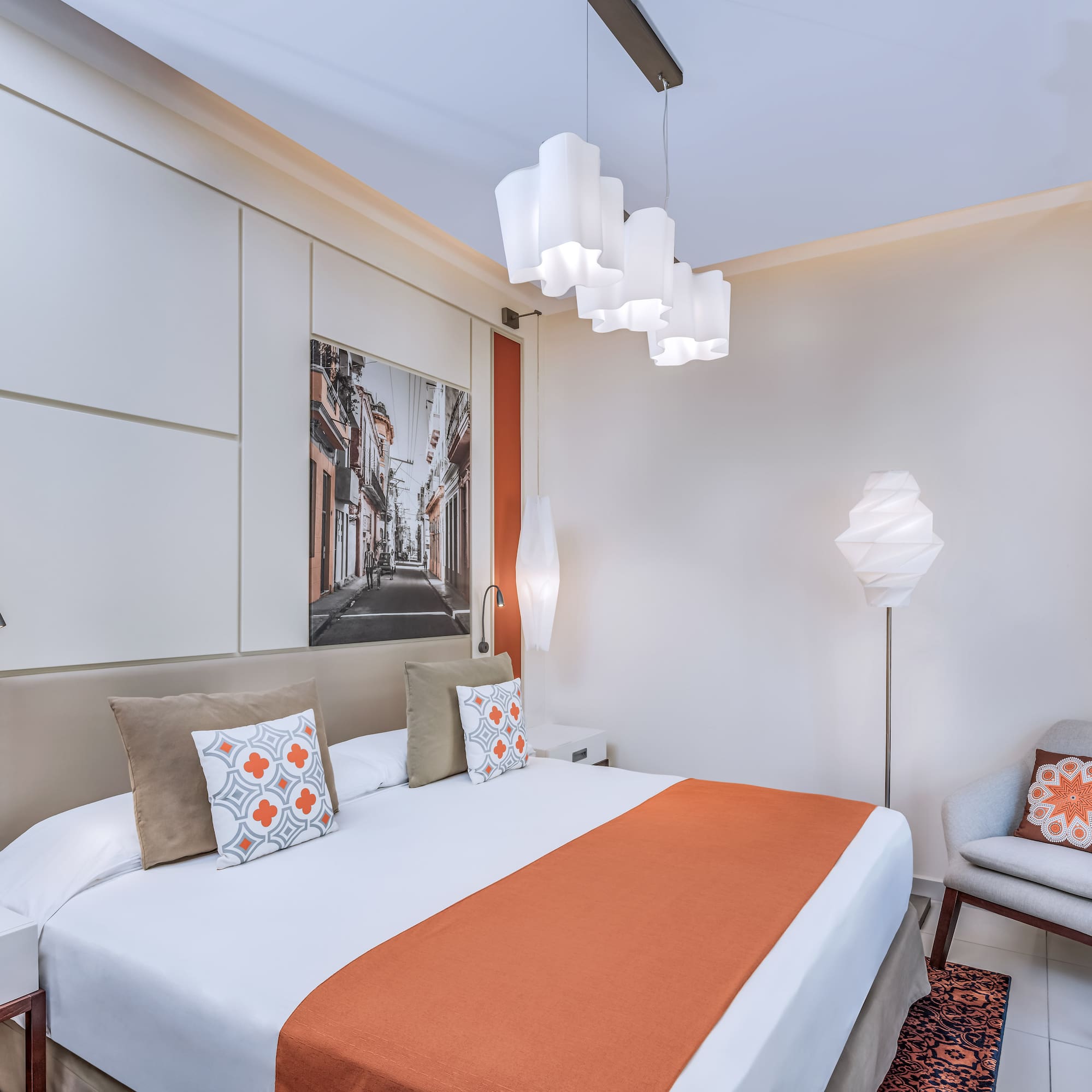 a bedroom with a bed and a chair