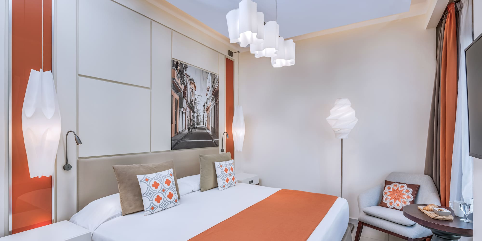 a bedroom with a bed and a chair