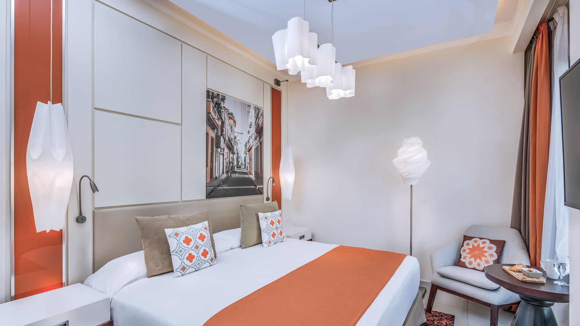 a bedroom with a bed and a chair