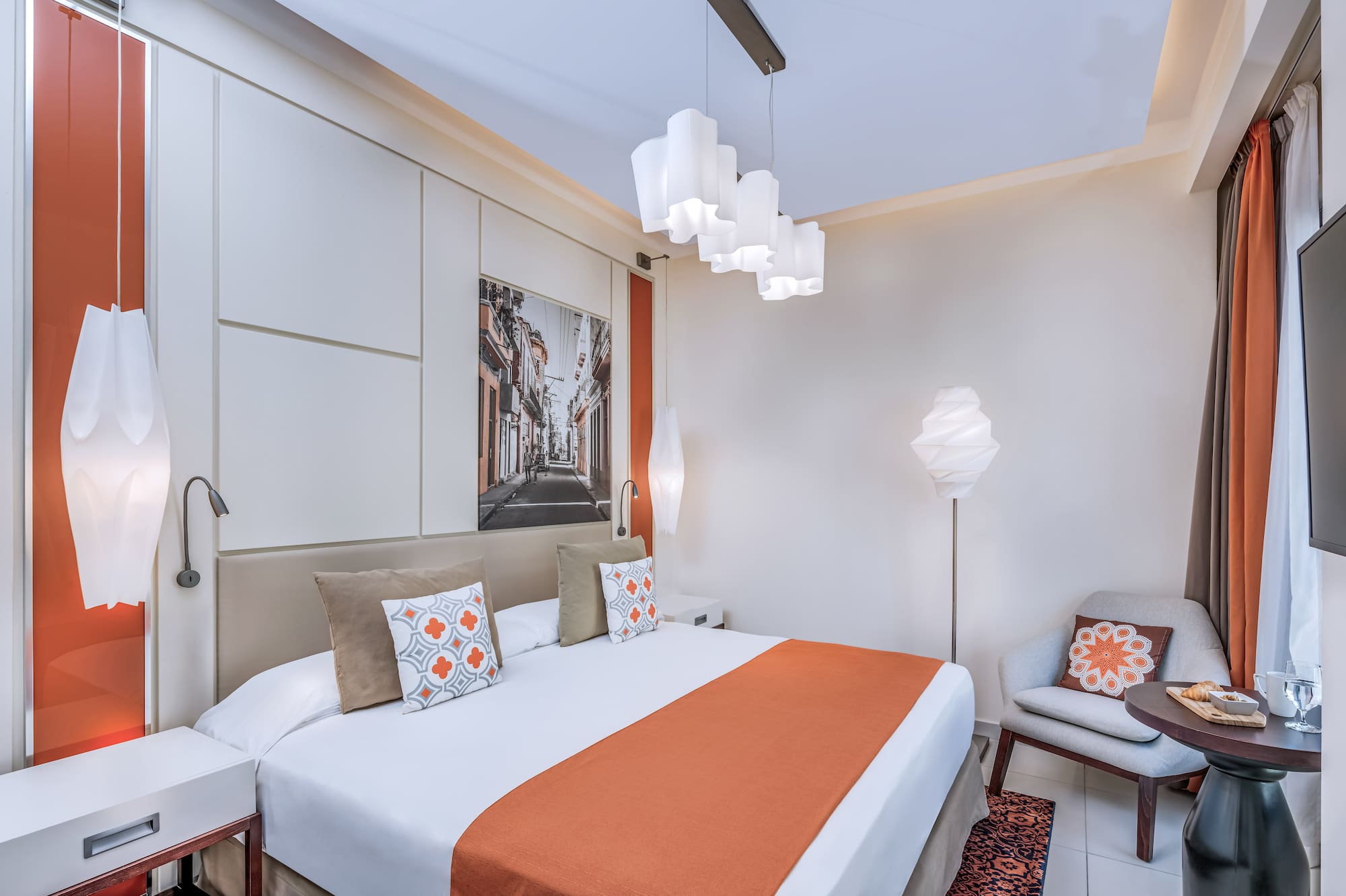 a bedroom with a bed and a chair