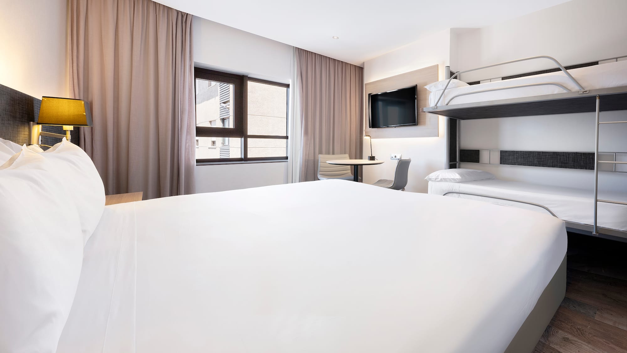 a room with a bunk bed and a tv