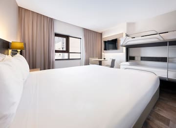 a room with a bunk bed and a tv