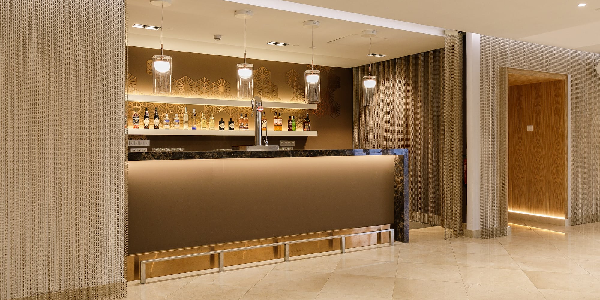 a bar with a counter and shelves