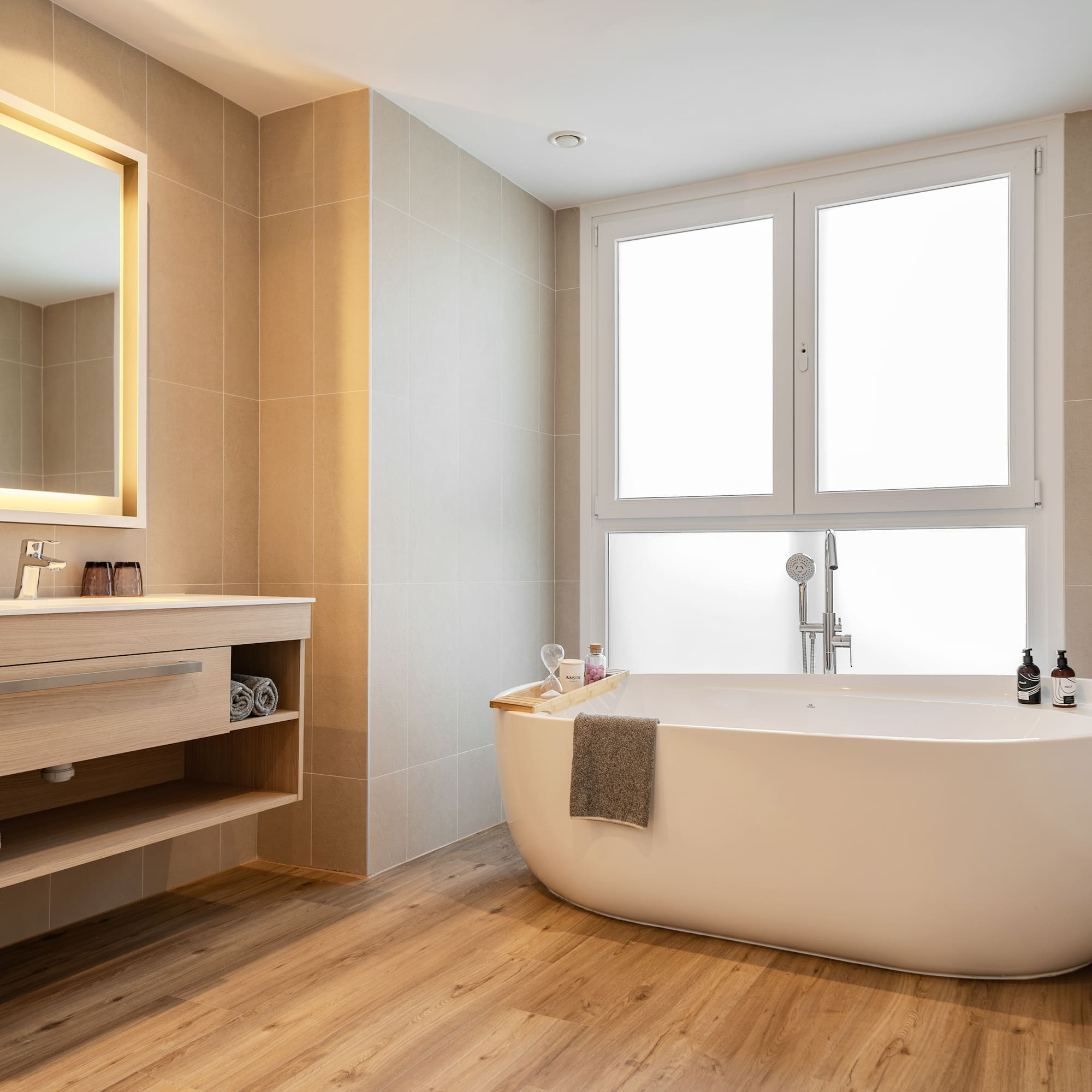 a bathroom with a tub and sink