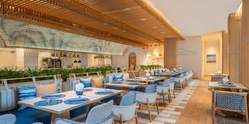 a restaurant with tables and chairs